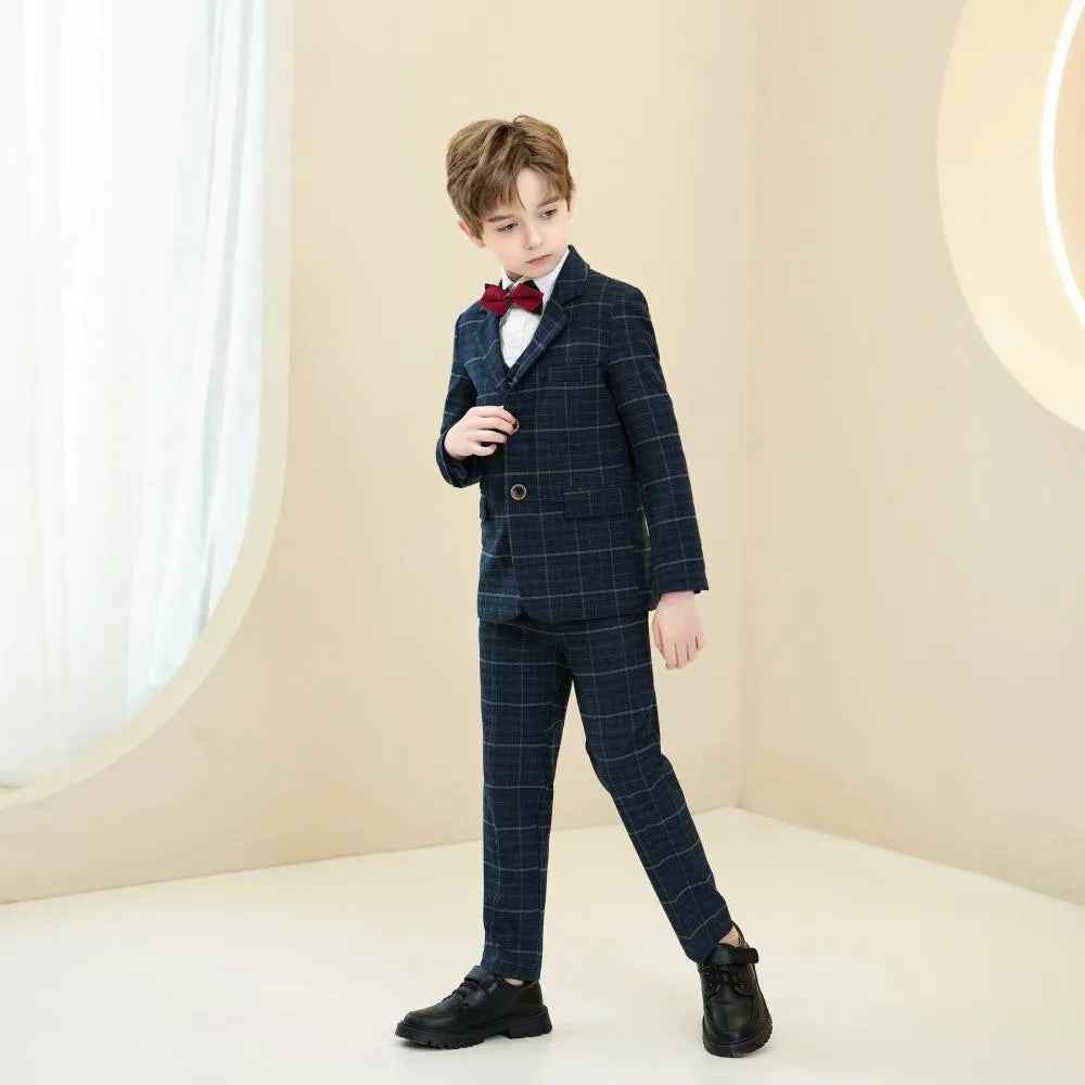 Slim fit navy plaid boys 5-piece suit: Side view with red bow tie & modern formal style