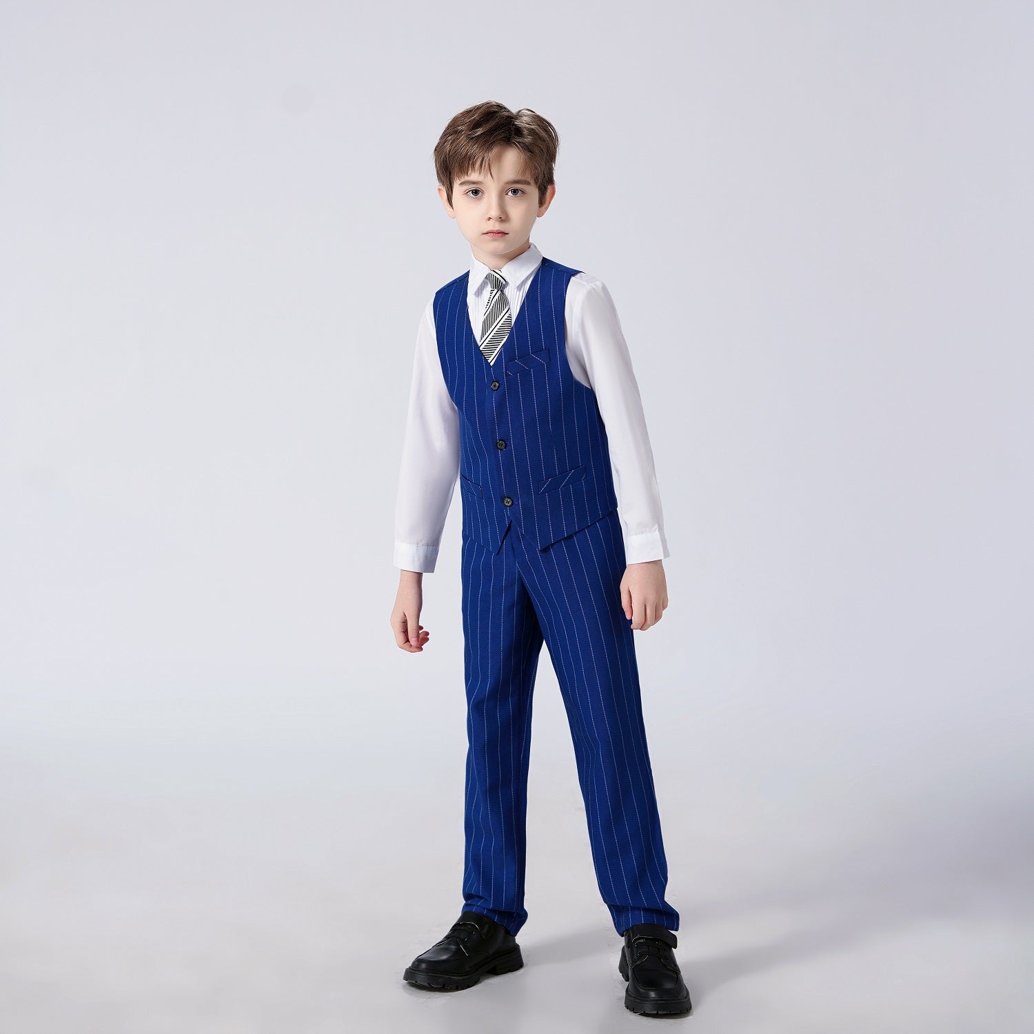 Front view of modern striped 4-piece royal blue boys suit – dressy slim vest and trousers set