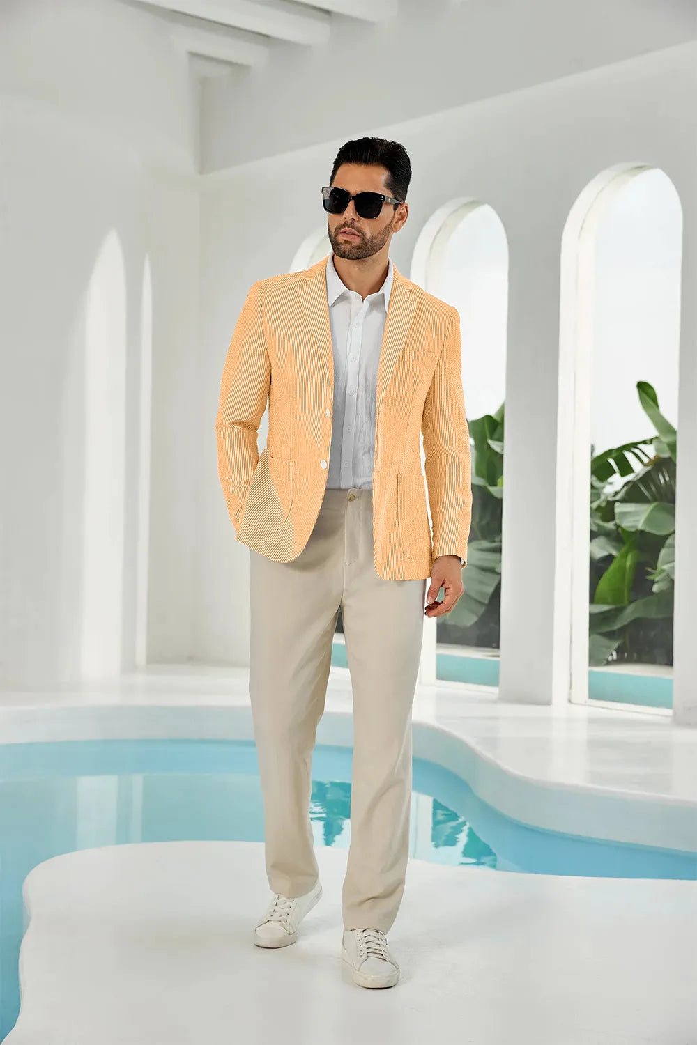 Orange-white seersucker striped men's summer blazer on model