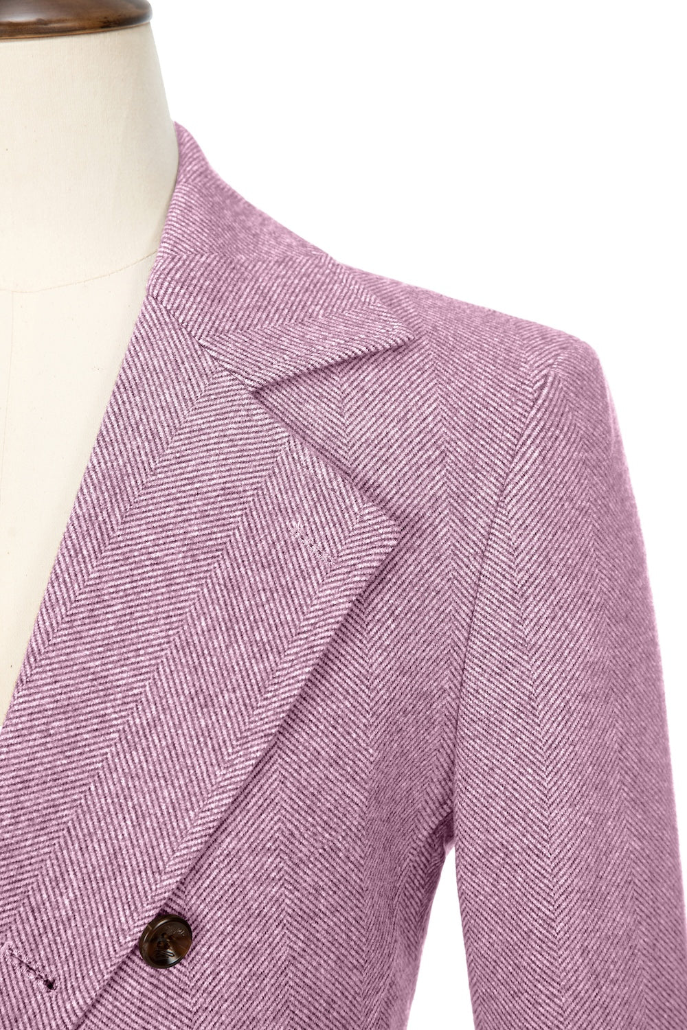 Pink close-up of lapel detail on double-breasted wool coat