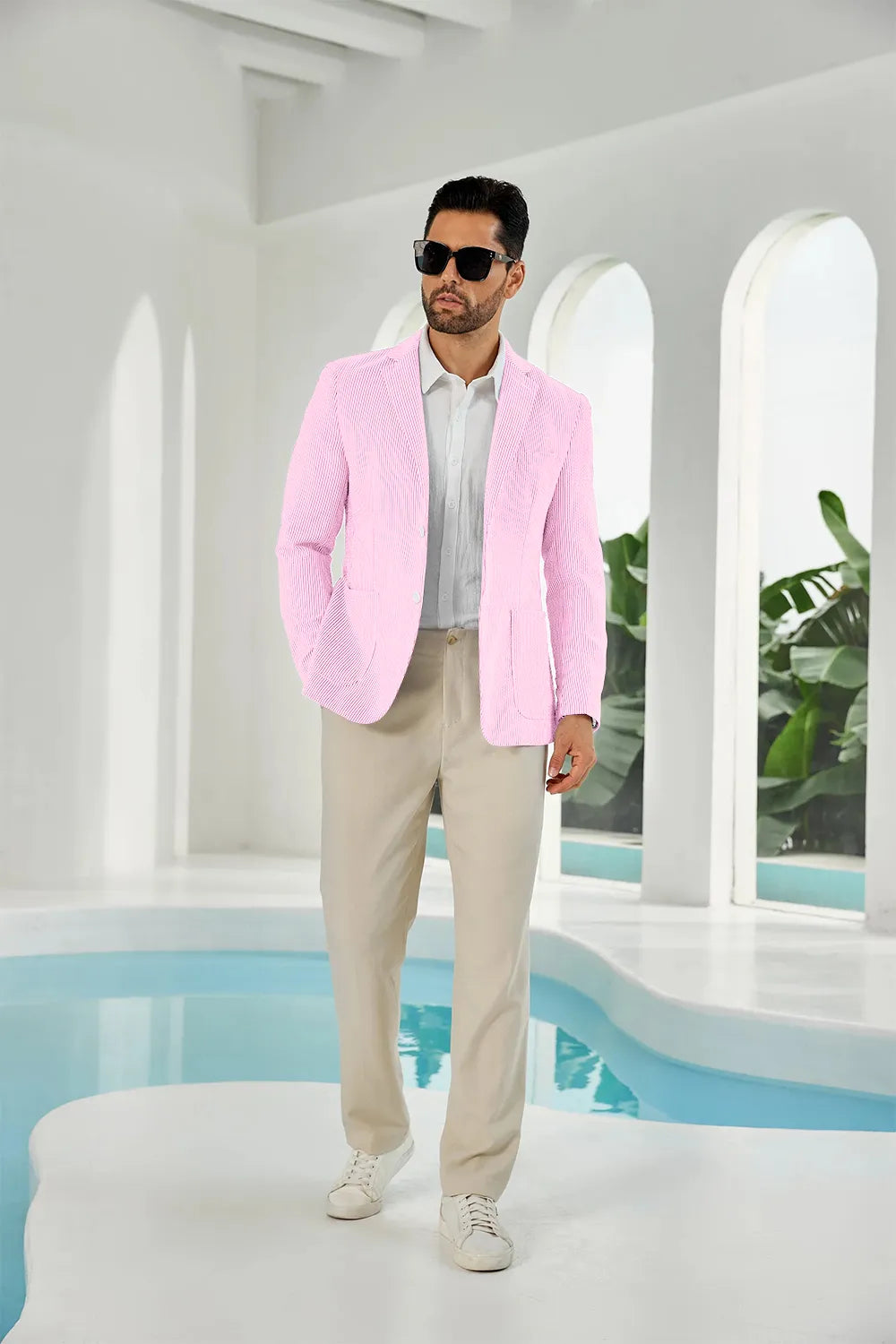 Pink-white seersucker striped men's summer blazer on model