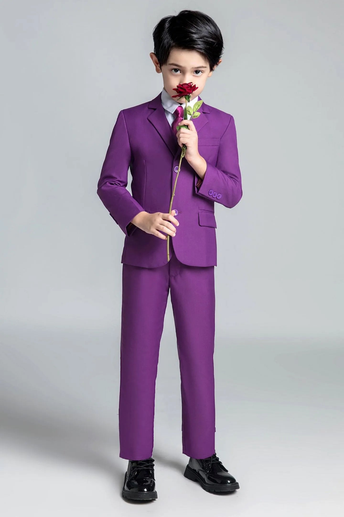 Purple 5-piece boys suit with matching tie, stylish choice for page boys and ceremonies
