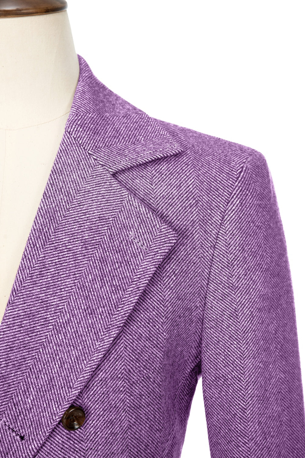 Purple close-up of lapel detail on double-breasted wool coat