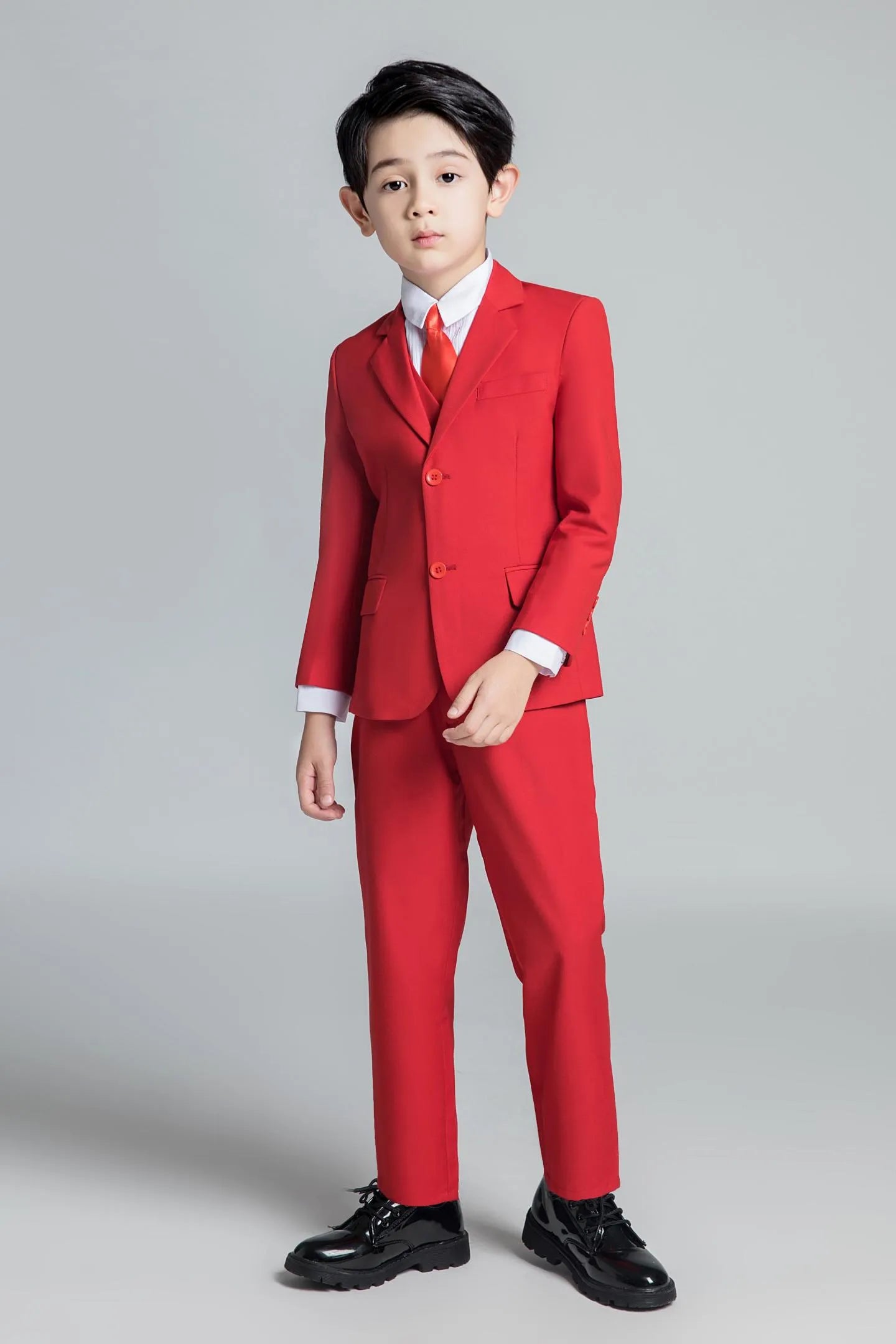 Red 5-piece boys formal suit with coordinating tie, suited for parties and page boy roles