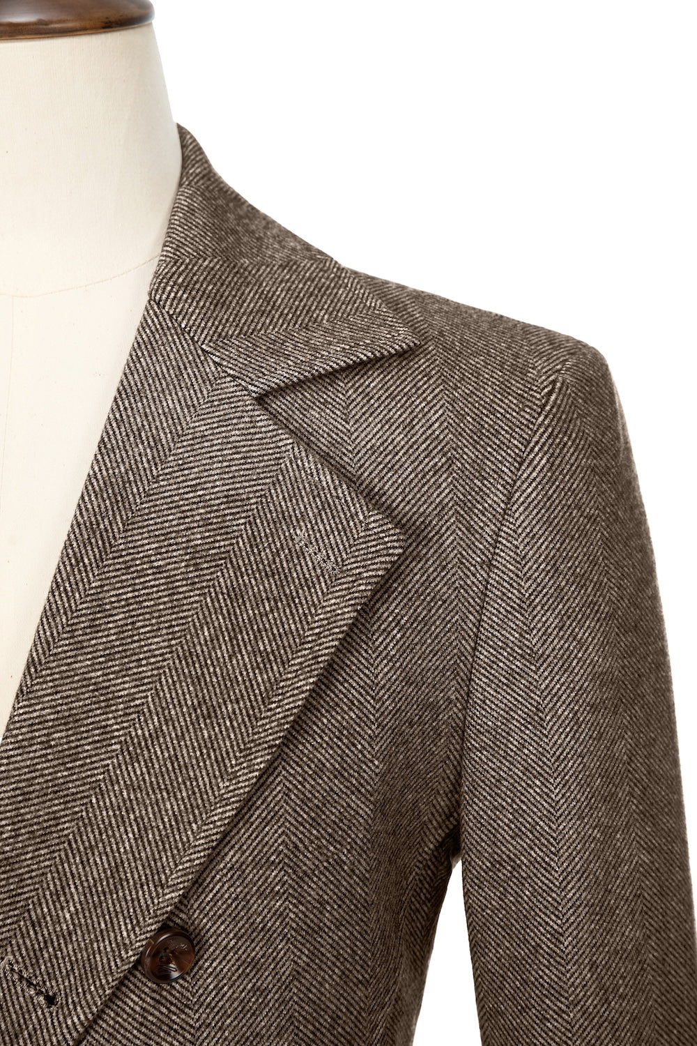 Red brown close-up of lapel detail on double-breasted wool coat