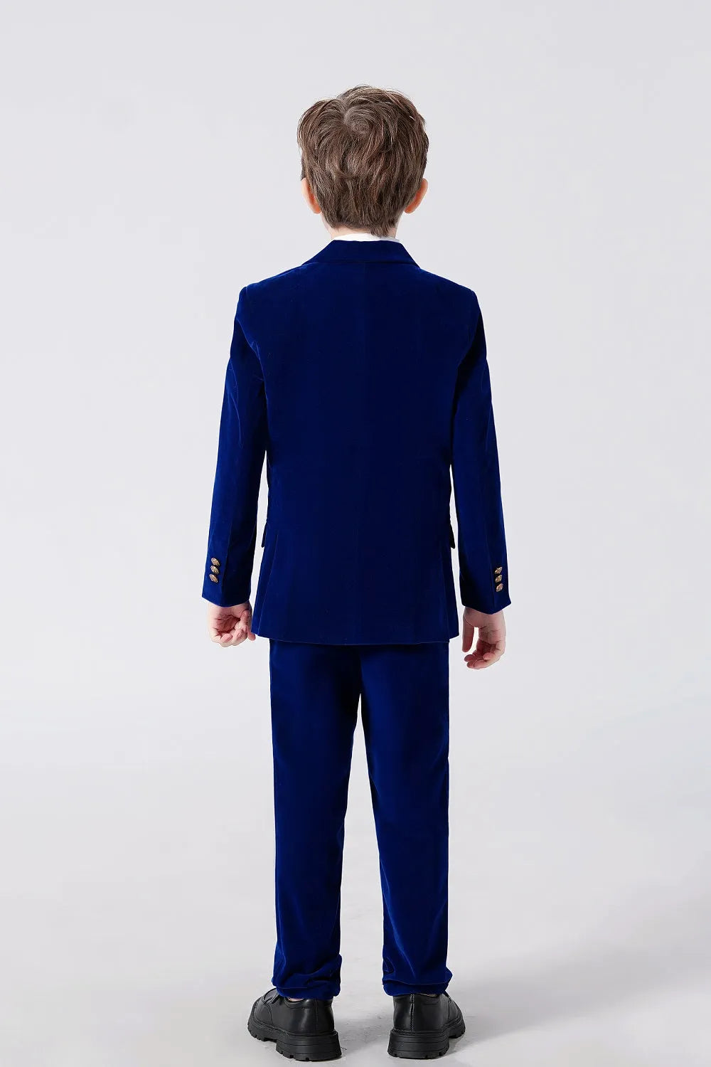 Back view of royal blue boys' velvet suit jacket and trousers – classic formalwear for holidays and parties