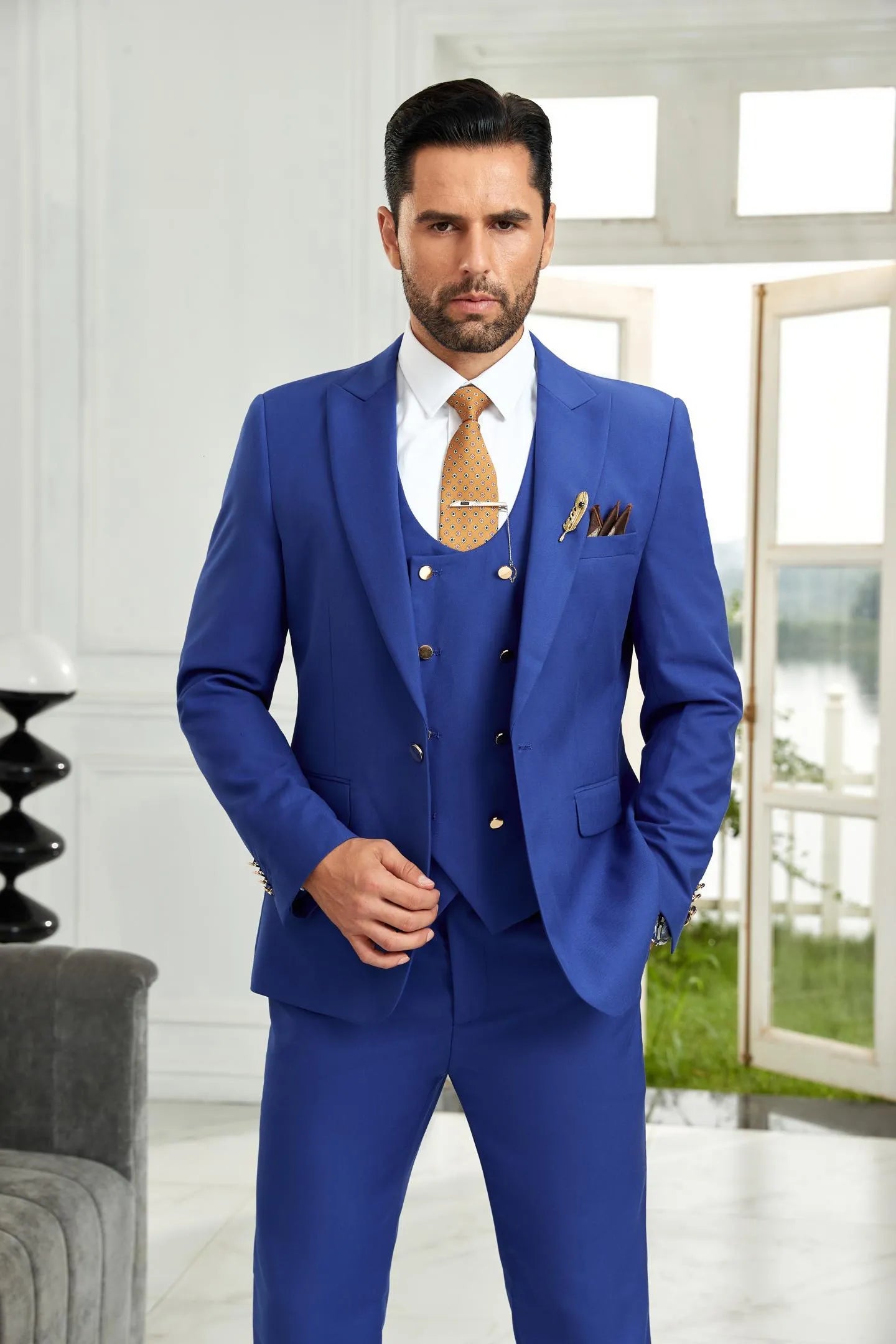 Close-up of royal blue 3 piece men's suit with tailored blazer and vest, styled with tie for business and wedding elegance.