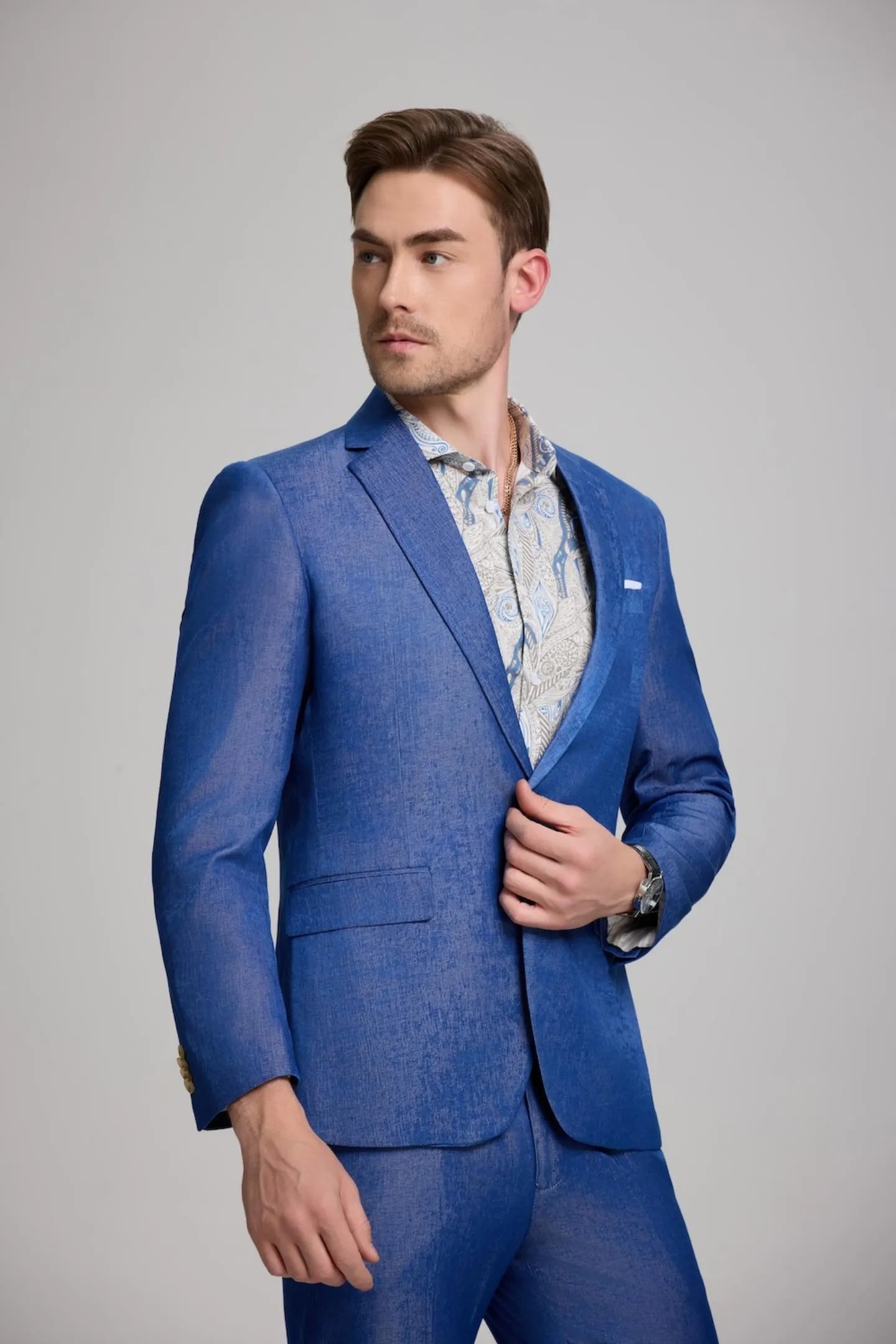 side view of men's royal blue slim fit suit with notch lapel blazer and trousers, offering a sleek modern fit for formal or casual settings.
