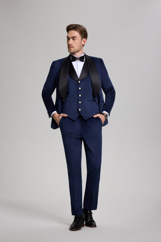 Stylish men's blue velvet tuxedo with elegant lapel and formal bow tie, perfect for gala events