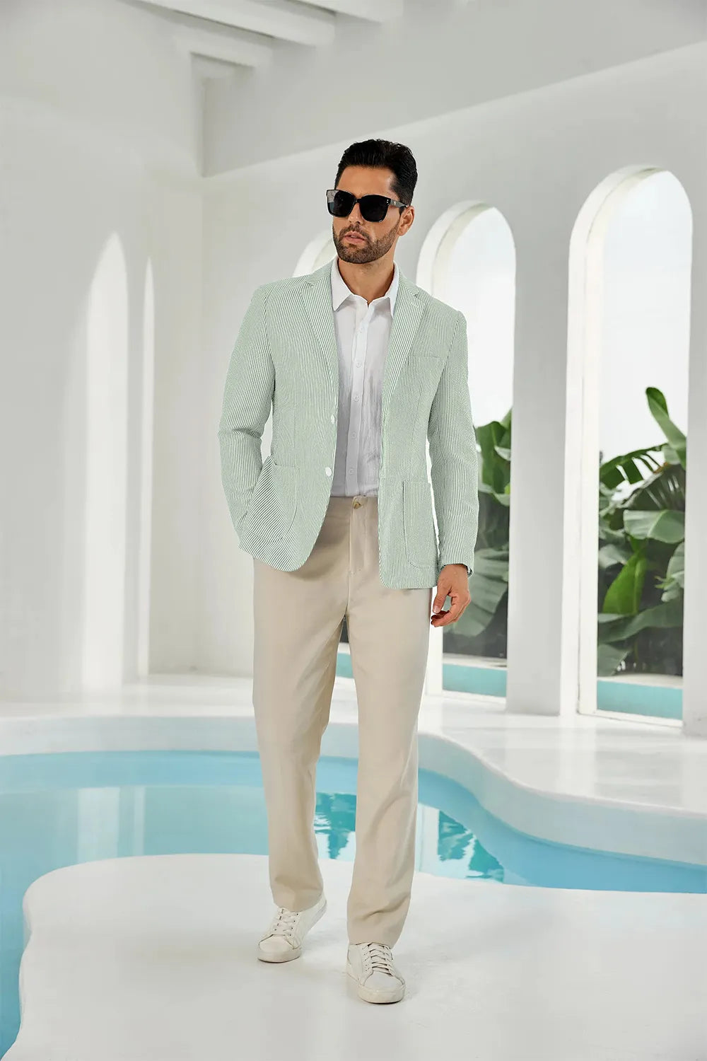 Front view of a sage green and white striped seersucker blazer for men, designed for summer comfort.