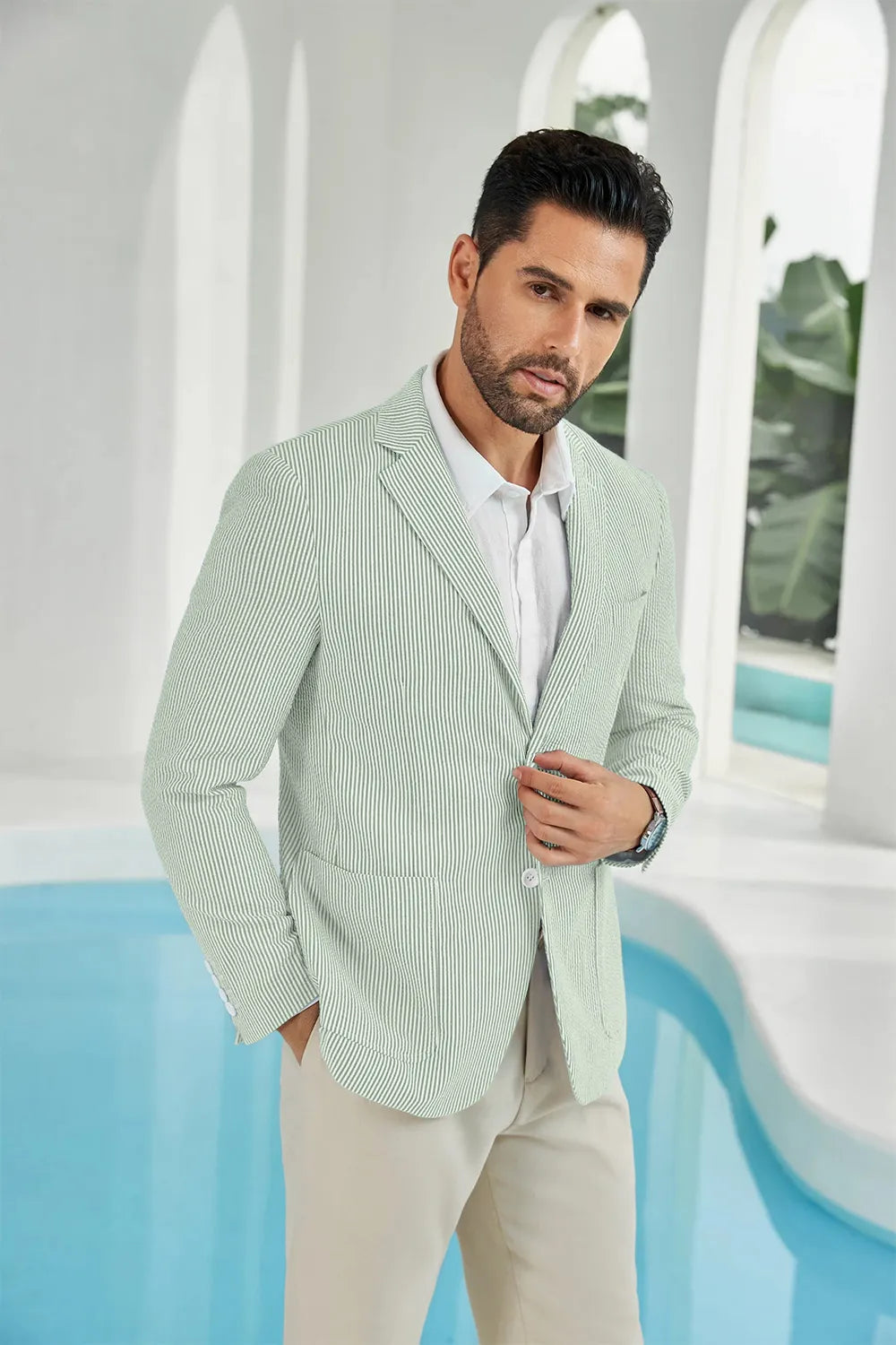 Sage green and white striped seersucker blazer for men, showcasing the side view of a lightweight summer suit.