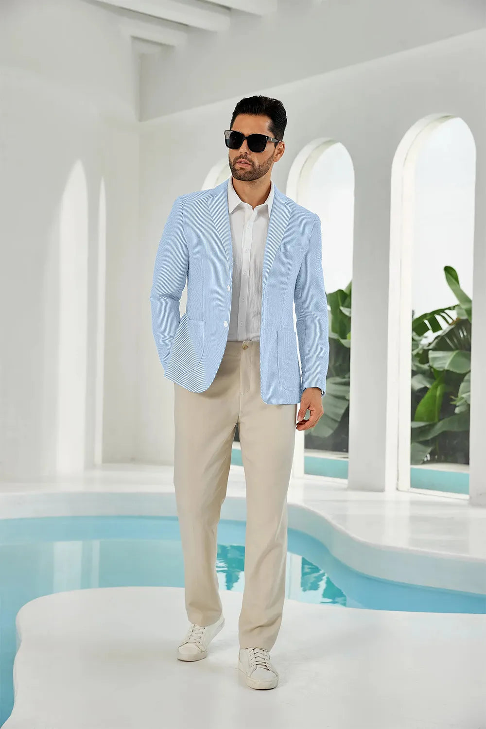 Sky blue-white seersucker striped men's summer blazer on model