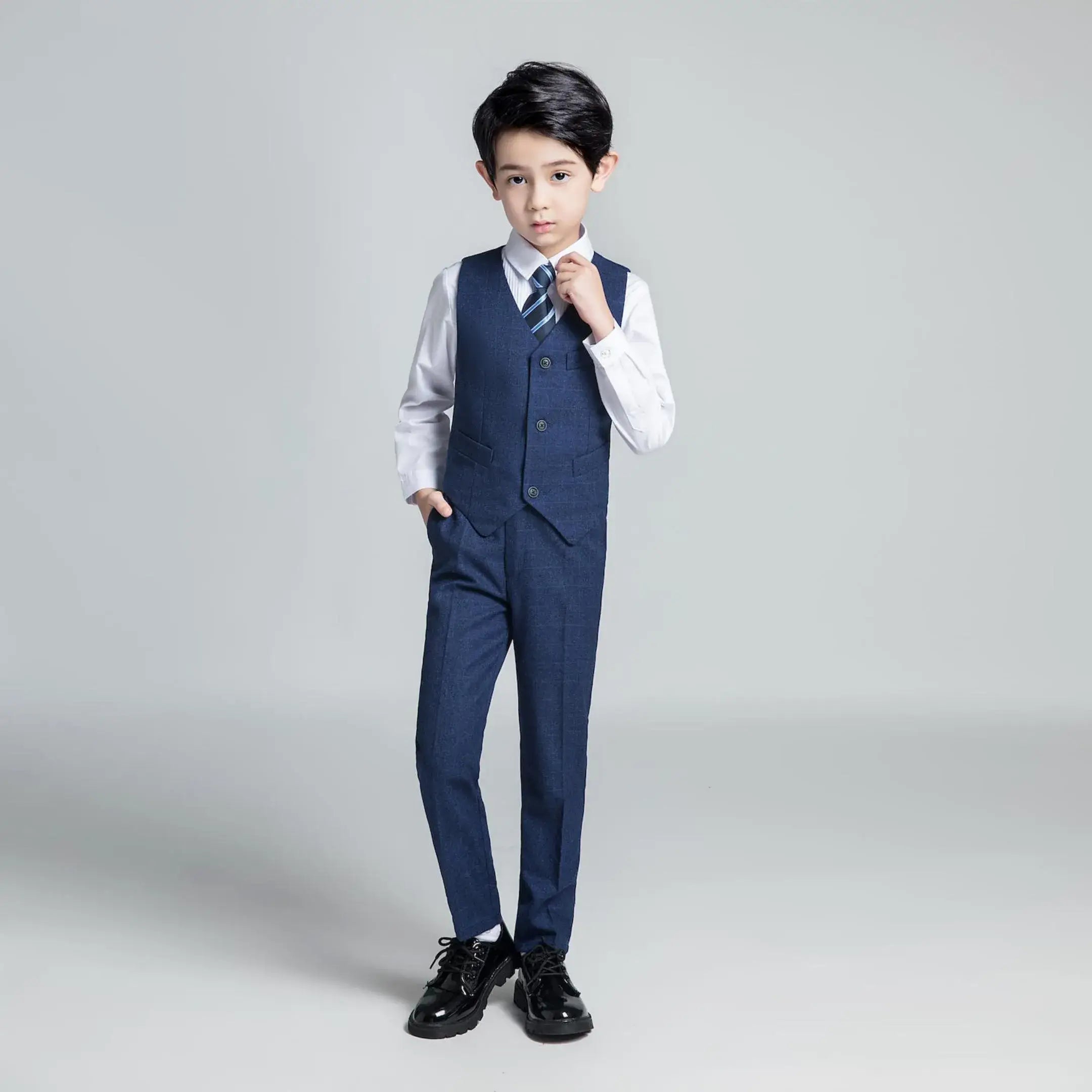Navy check boys vest and pants with striped tie – modern dresswear set for parties and formal events