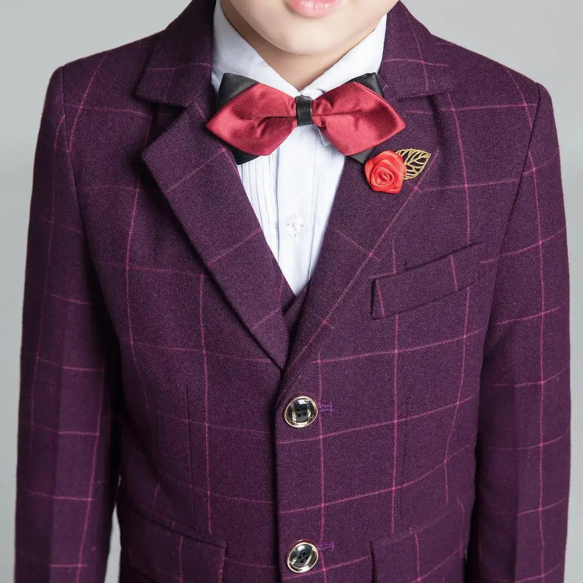 Boys' purple red plaid suit: Close-up of red bow tie & rose lapel pin