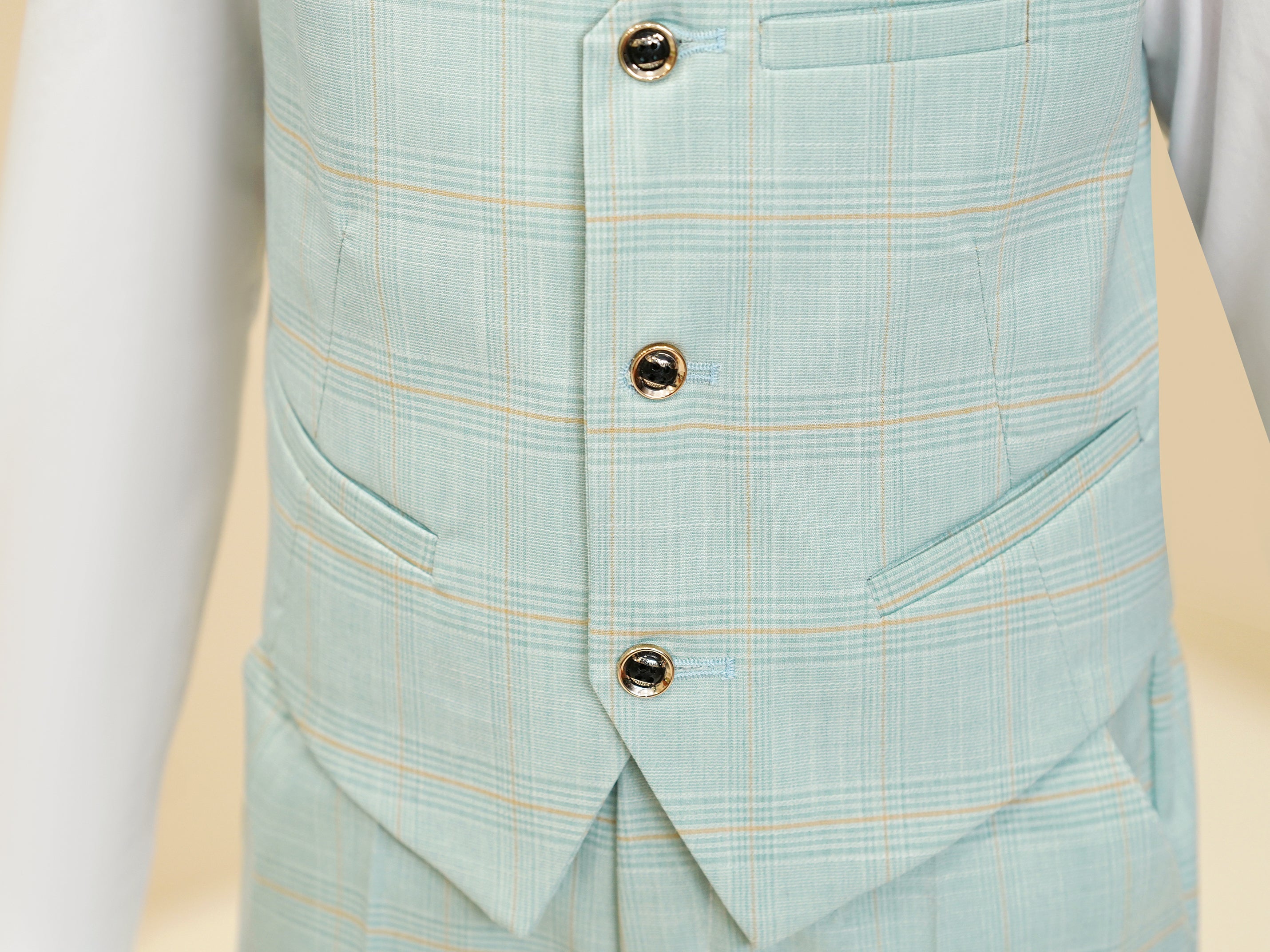 Detailed shot of boys formal mint green plaid pants with side pocket view