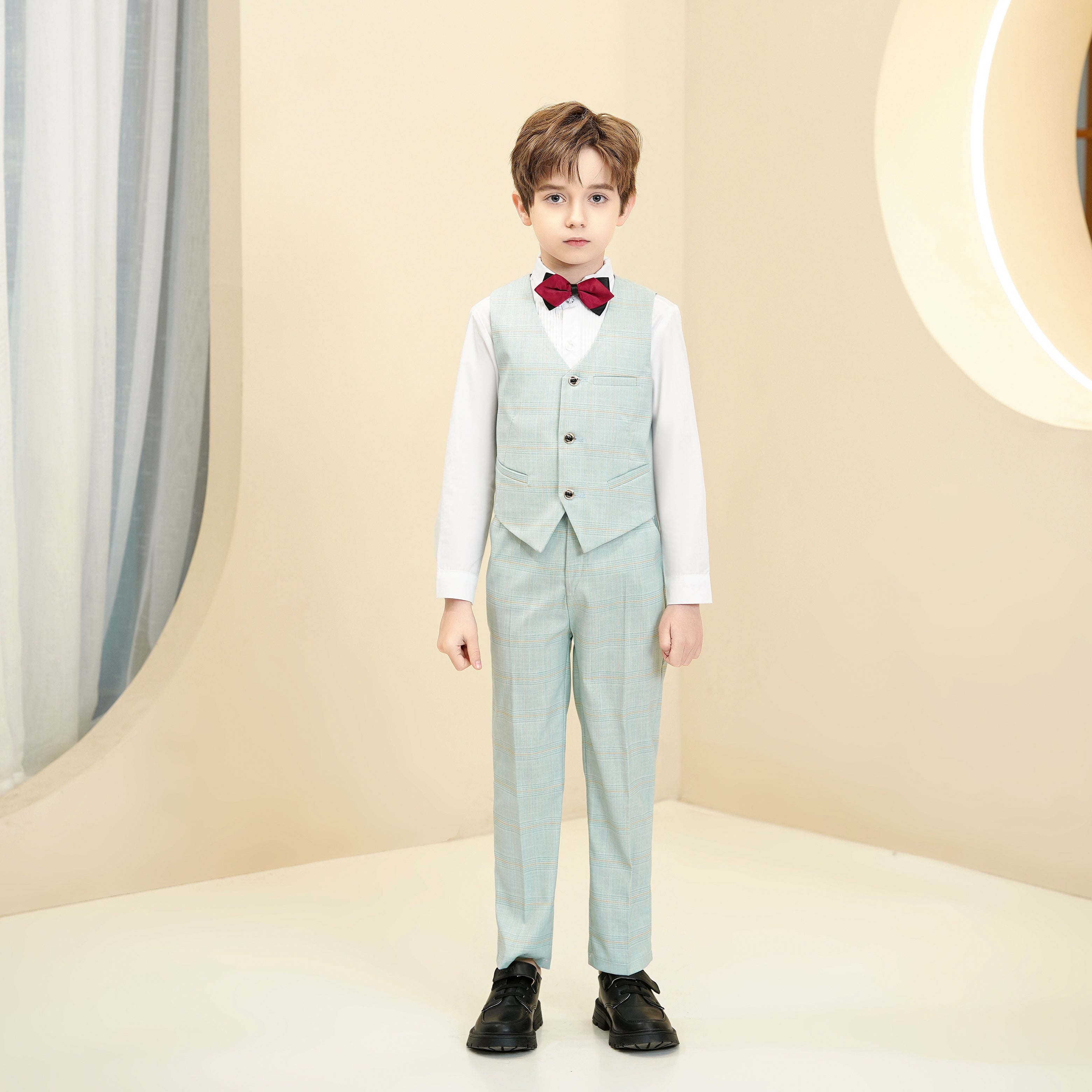 Front view of elegant boys mint green plaid suit with white shirt and bow tie
