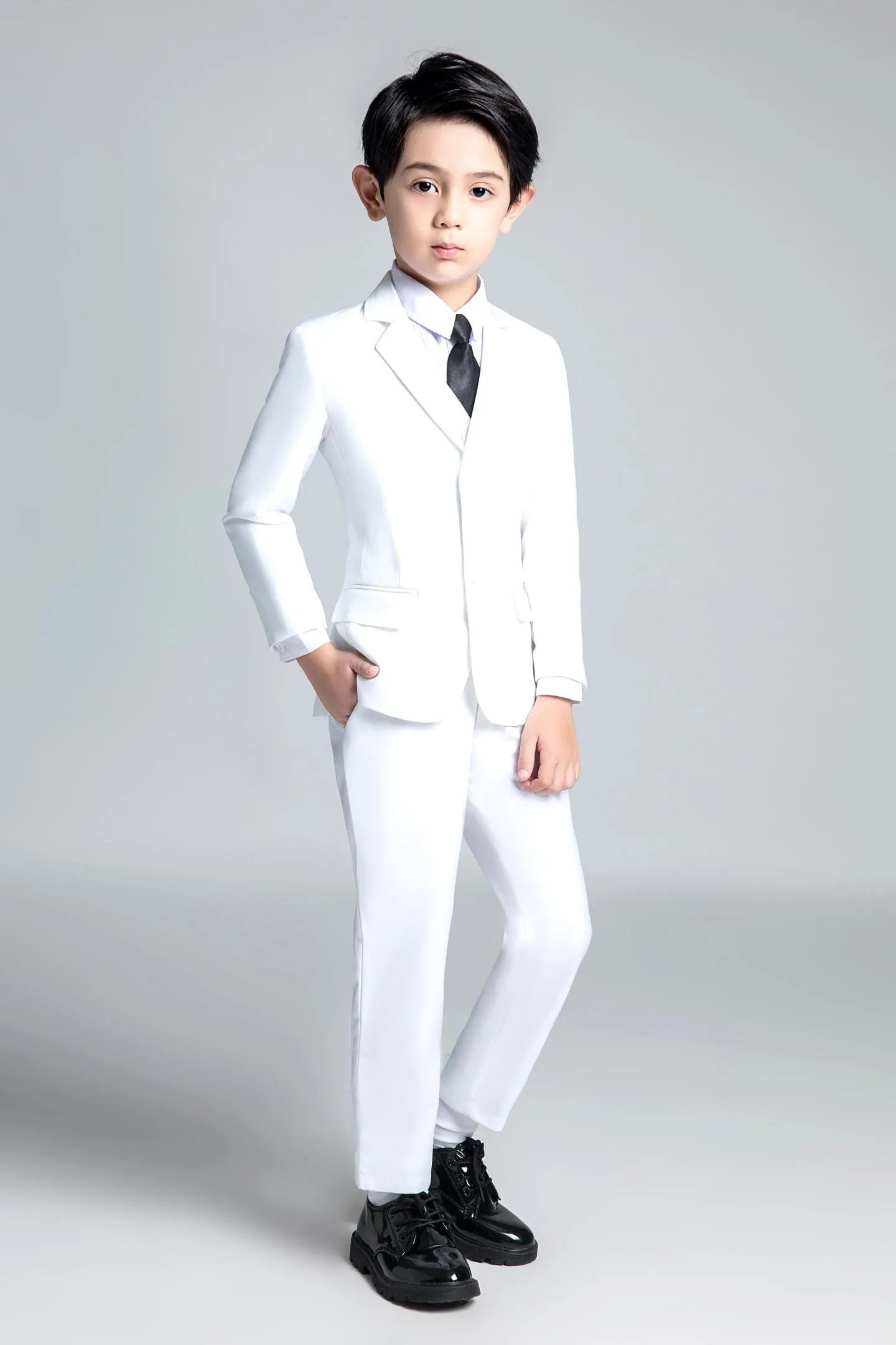 White 5-piece boys formal suit with satin tie, ideal for weddings or communions