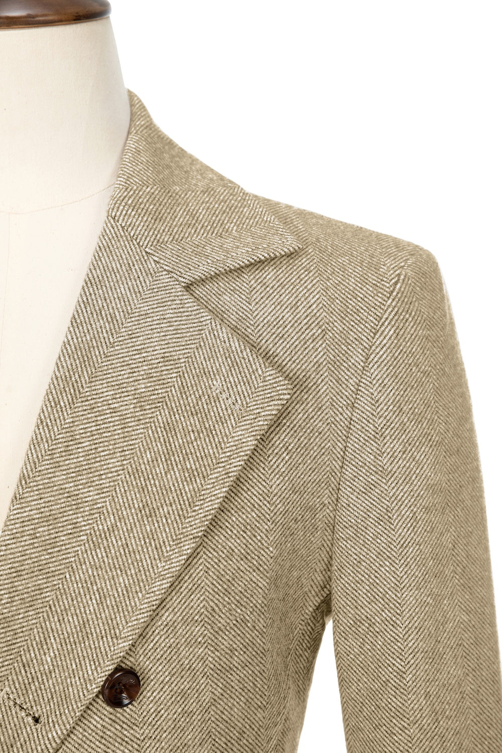 Yellow close-up of lapel detail on double-breasted wool coat