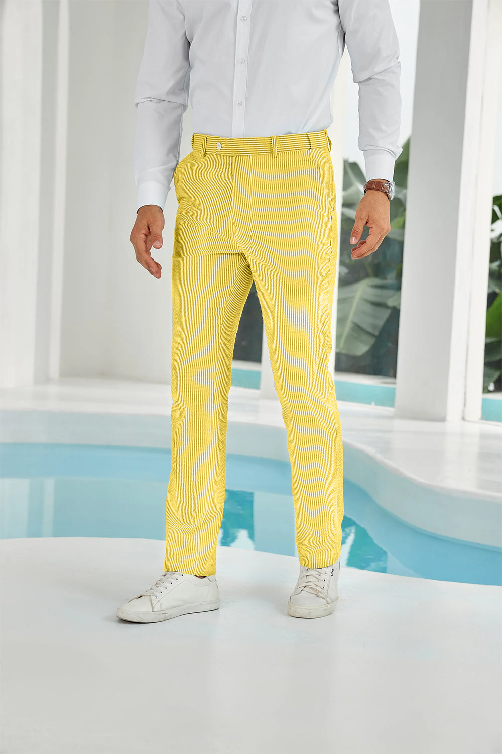 Front view of yellow seersucker pants with subtle stripes and white shirt