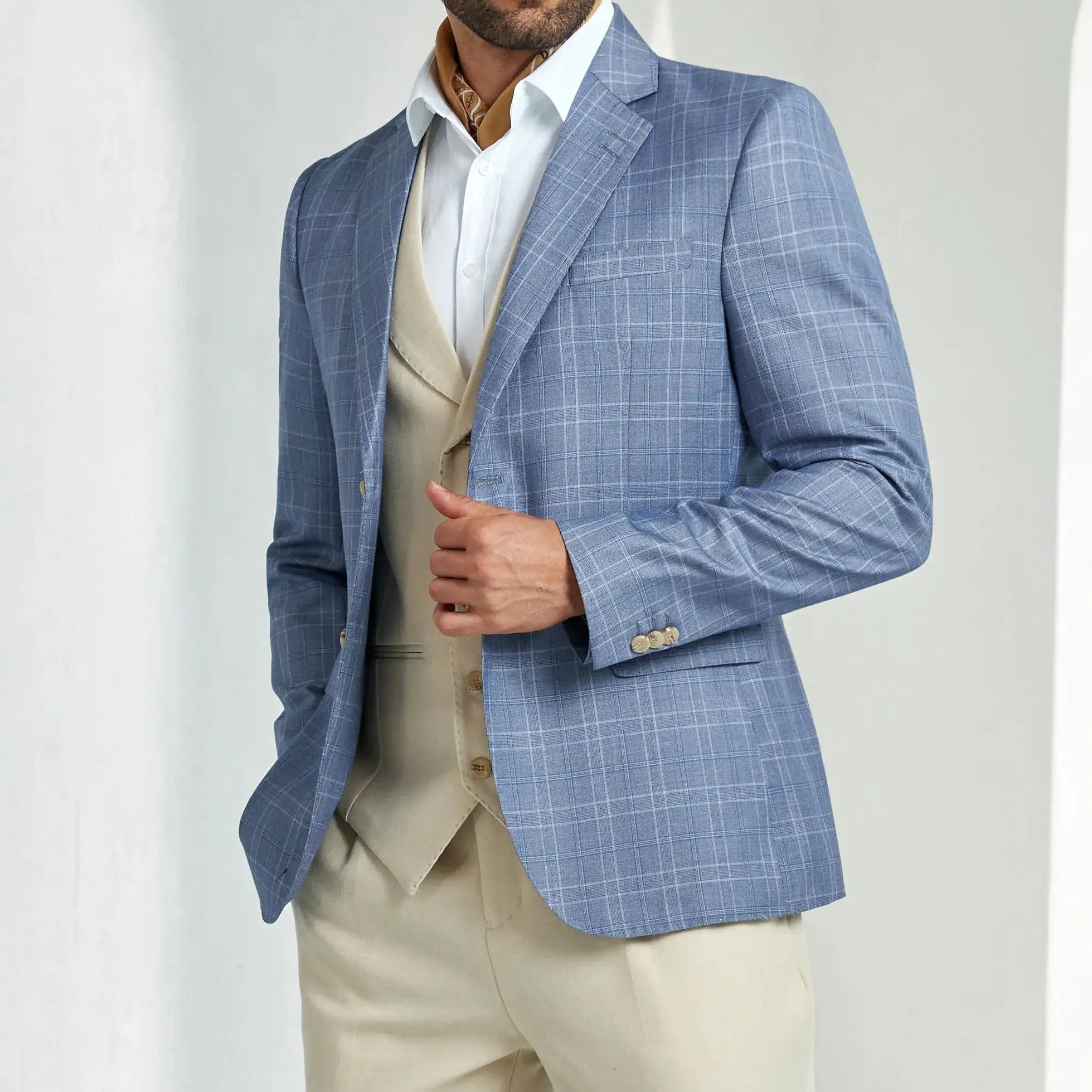 Blue two-button plaid blazer with formal beige vest and trousers