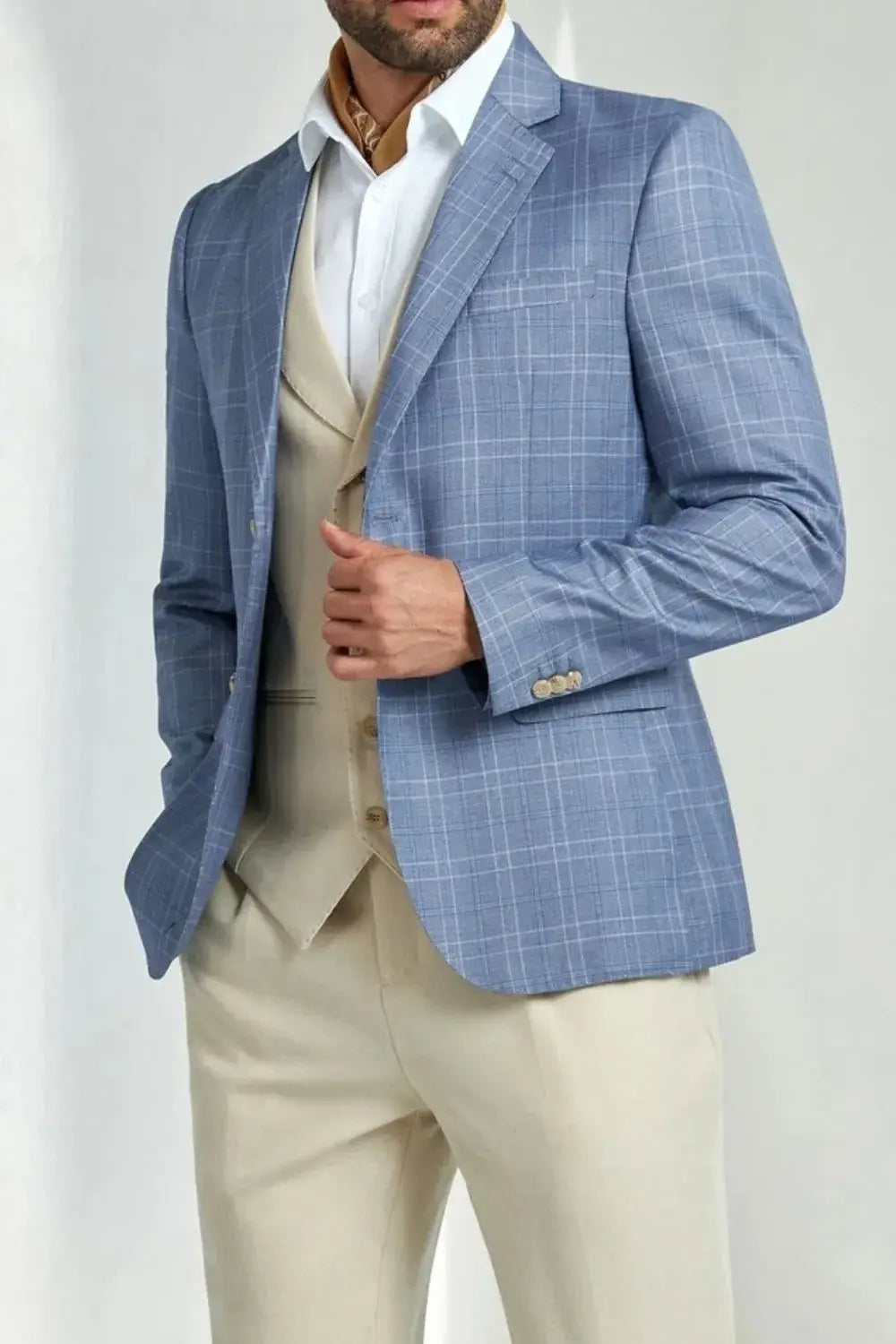 Blue plaid men’s blazer with notched lapel and beige waistcoat