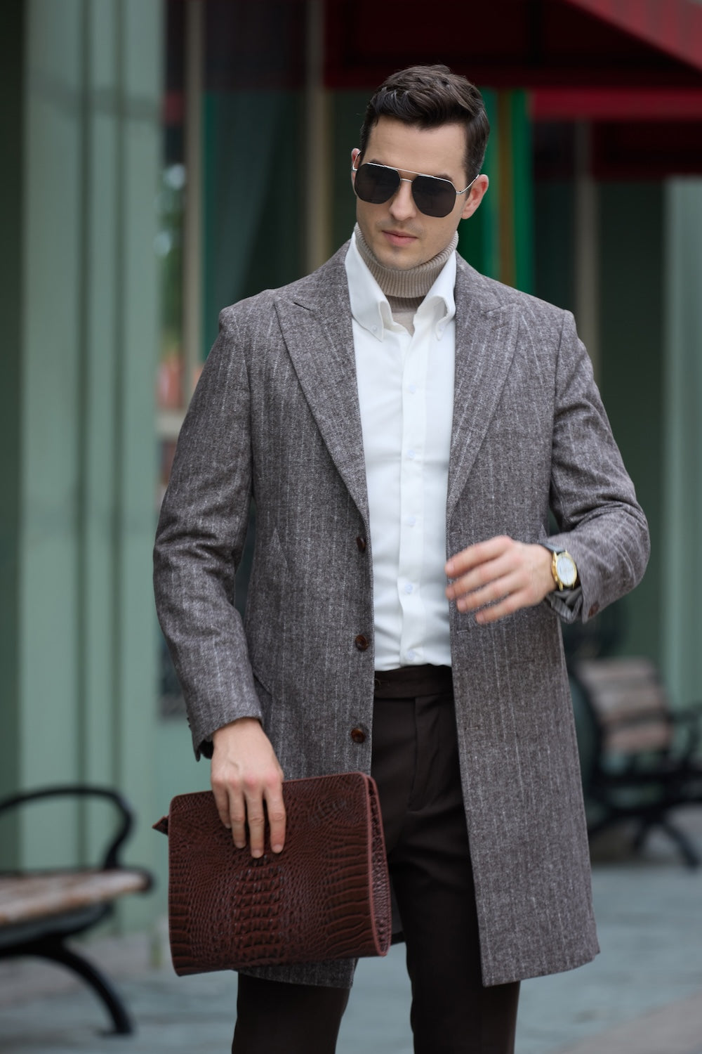 Grey wool trench coat for men – mid-stride outdoor fashion shot