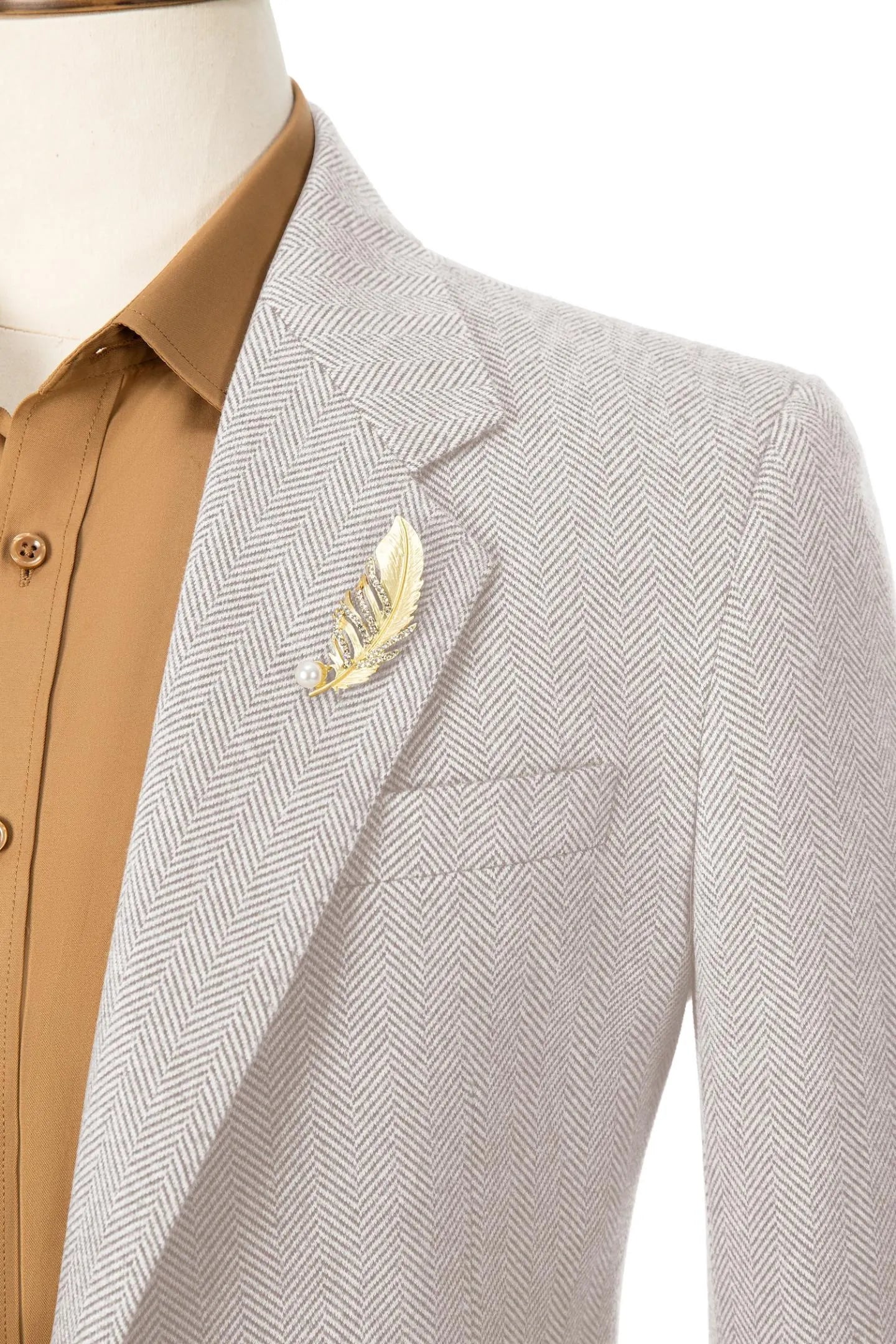 Close-up of the collar on men's light beige herringbone business blazer – highlighting fine craftsmanship and details