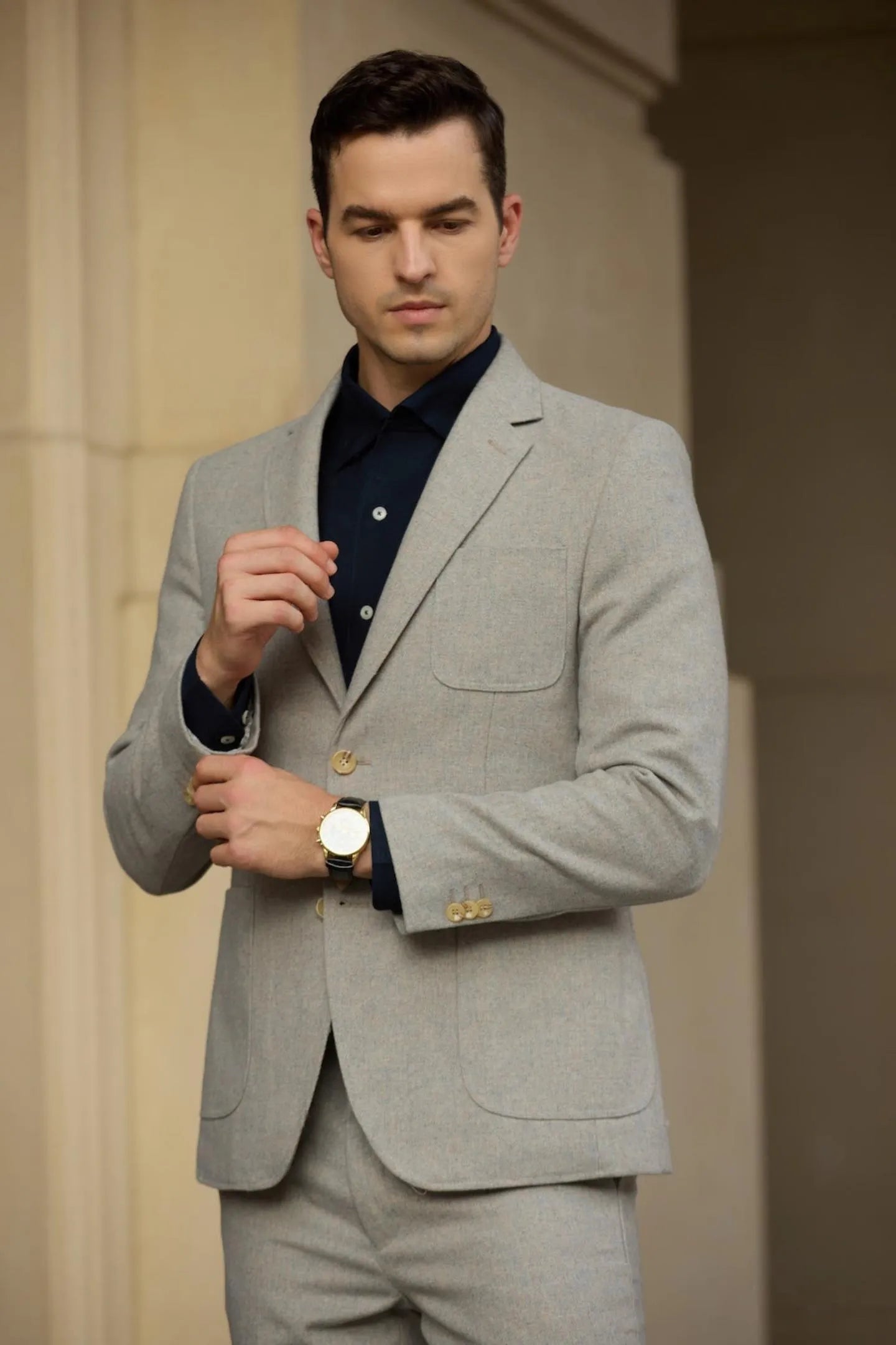left side view of grey wool herringbone 2 piece suit blazer – highlighting tailored business fit and classic winter design