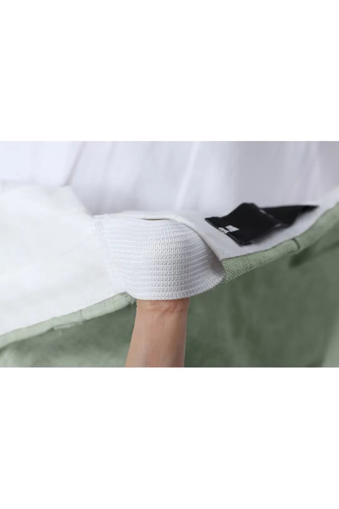 Shoulder padding and lining inside light green men’s linen suit jacket