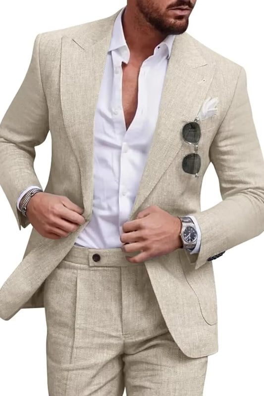 Close-up of men's beige linen slim fit 2 piece suit featuring peaked lapel jacket and flat-front trousers, paired with white shirt for casual summer wear.