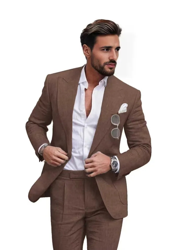 Man wearing coffee slim fit linen 2 piece summer suit with peaked lapel blazer, styled with shirt for prom or casual events.