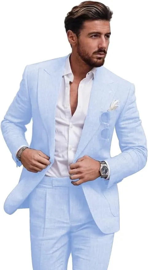 Front view of man in sky blue slim fit linen 2 piece summer suit with peaked lapel blazer, styled for beach weddings or casual wear.