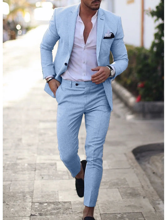Close-up of light blue men's summer blazer paired with matching trousers and pocket square.
