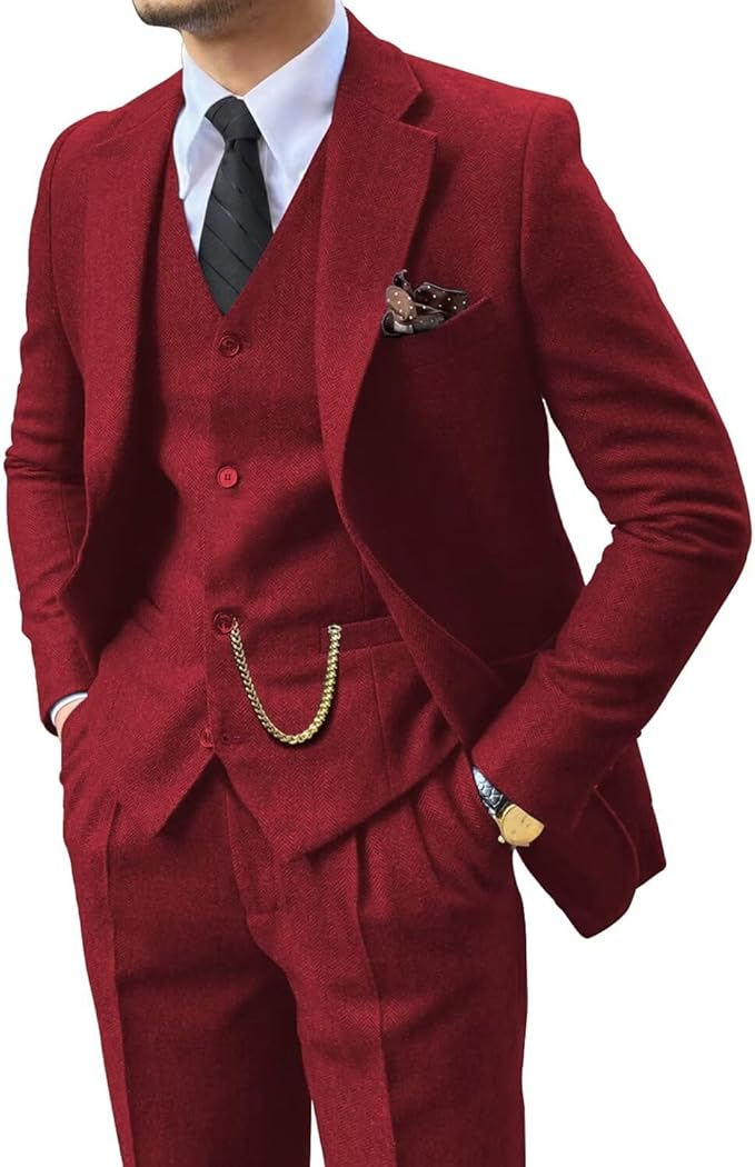 angled upper body close-up of slim fit burgundy herringbone suit for men with vest and tie