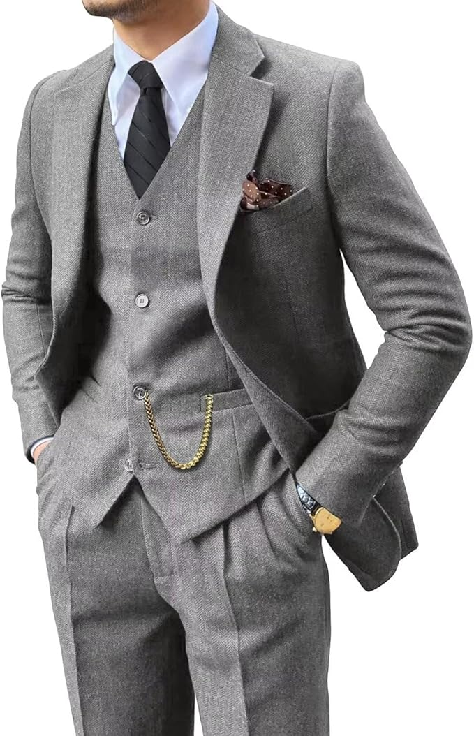 angled upper body close-up of slim fit light grey herringbone suit for men with vest and tie