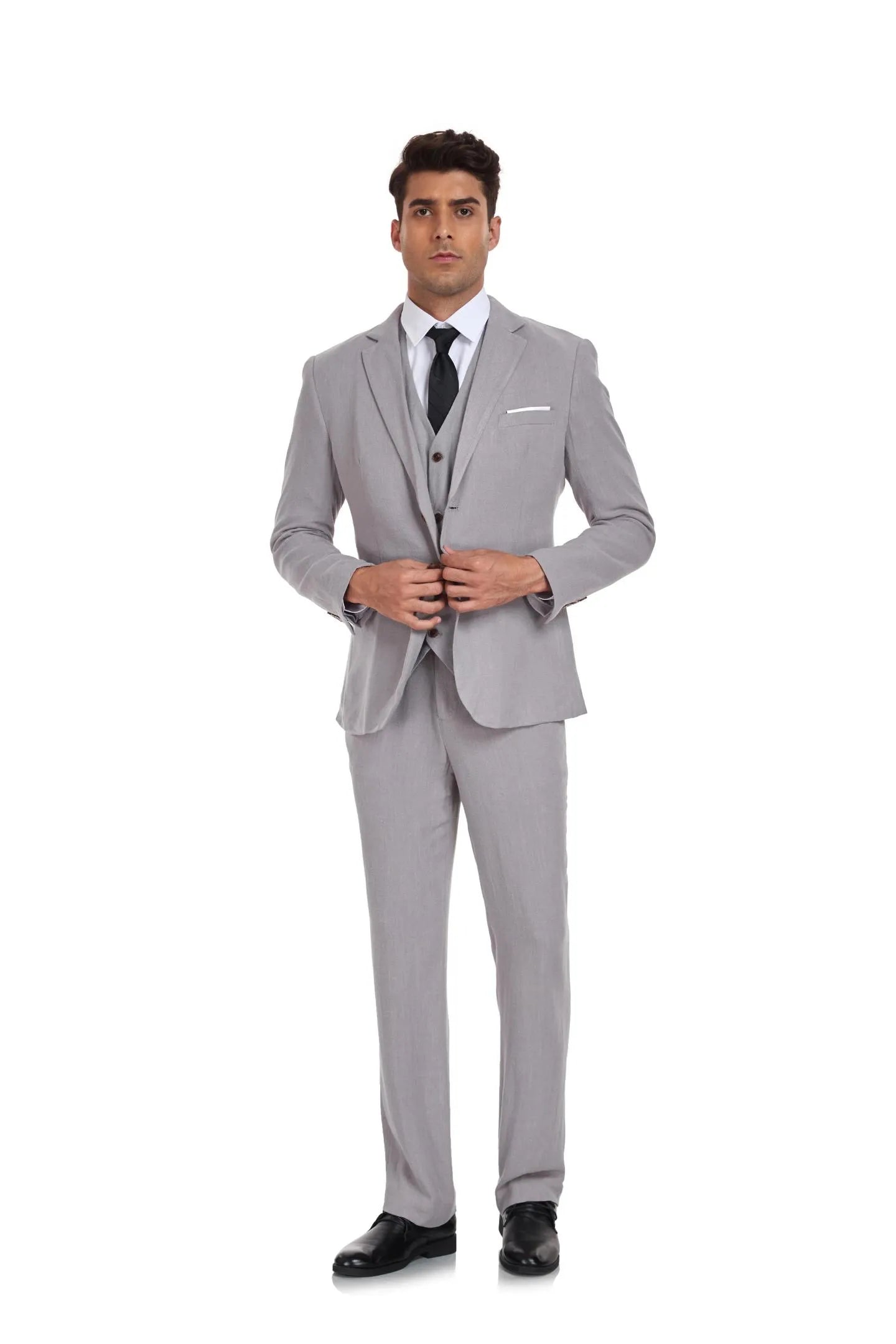 Grey 3 piece linen suit for men with blazer, vest and trousers – slim fit retro wedding suit style, paired with black tie and white dress shirt.