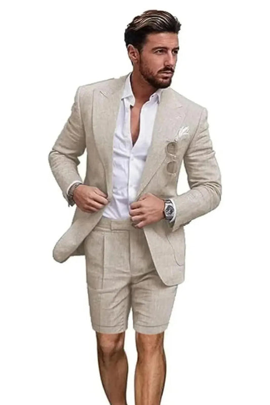 Front view of man in beige linen 2 piece short suit – slim fit peaked lapel blazer with shorts and white shirt for summer.