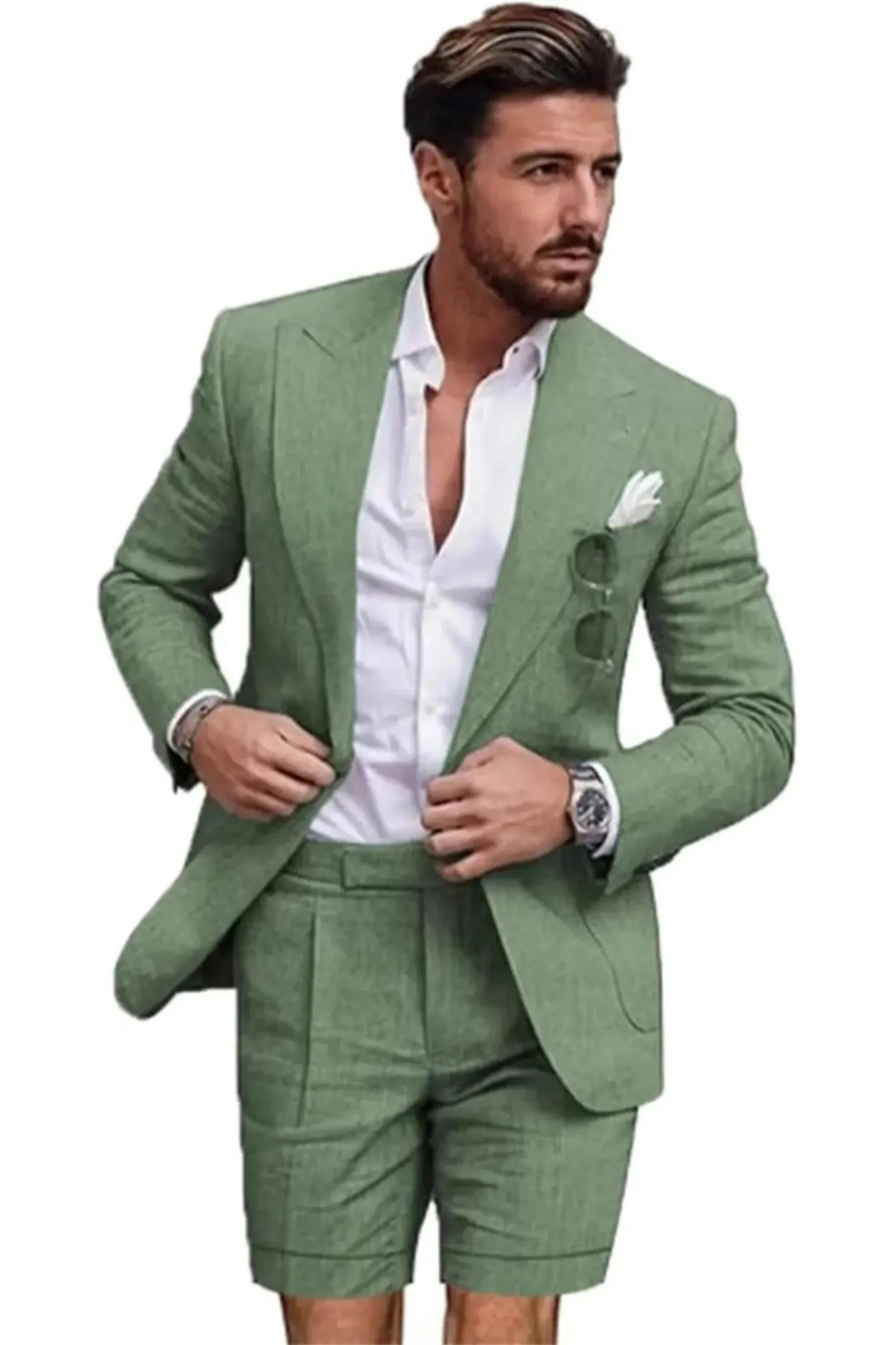Close-up of sage green linen slim fit 2 piece short suit – peaked lapel blazer with shorts and white shirt, summer outfit for men.