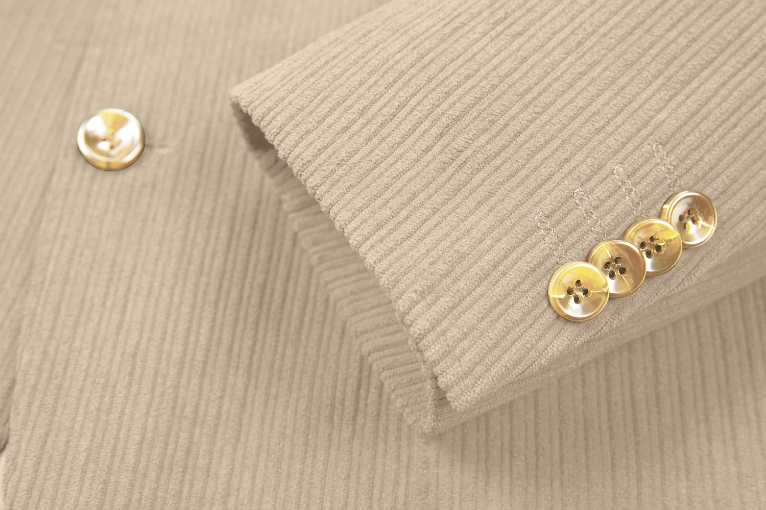 Cuff detail of beige corduroy blazer – winter style sleeve with button accents