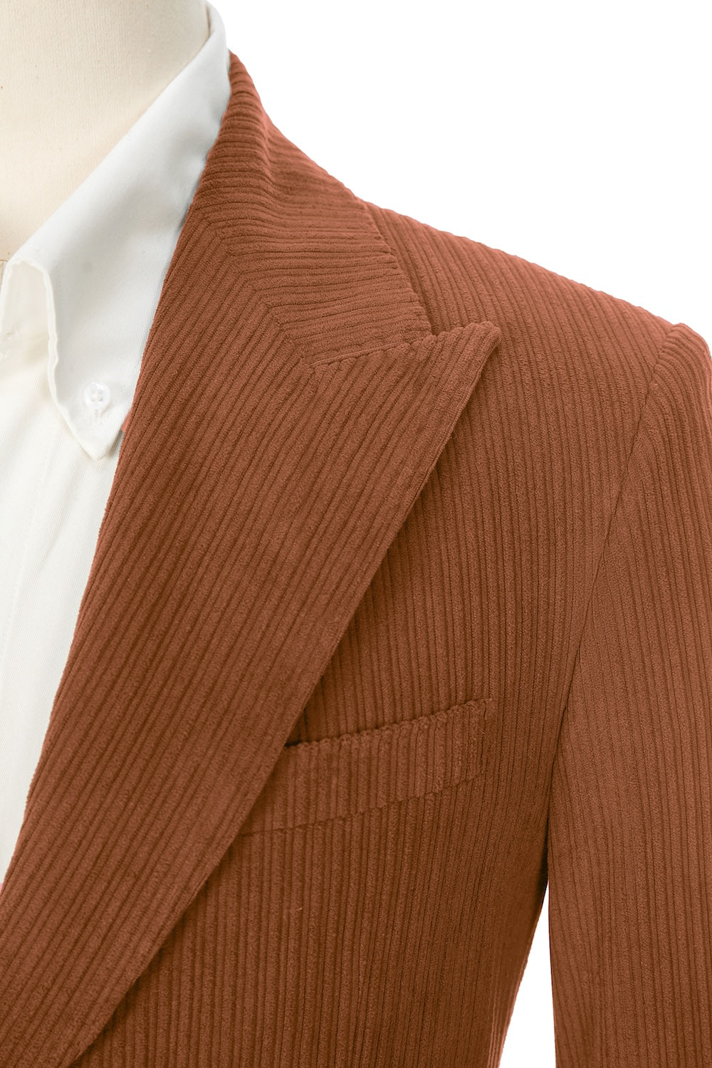 Close-up of caramel corduroy blazer lapel – textured peak lapel and stitching detail