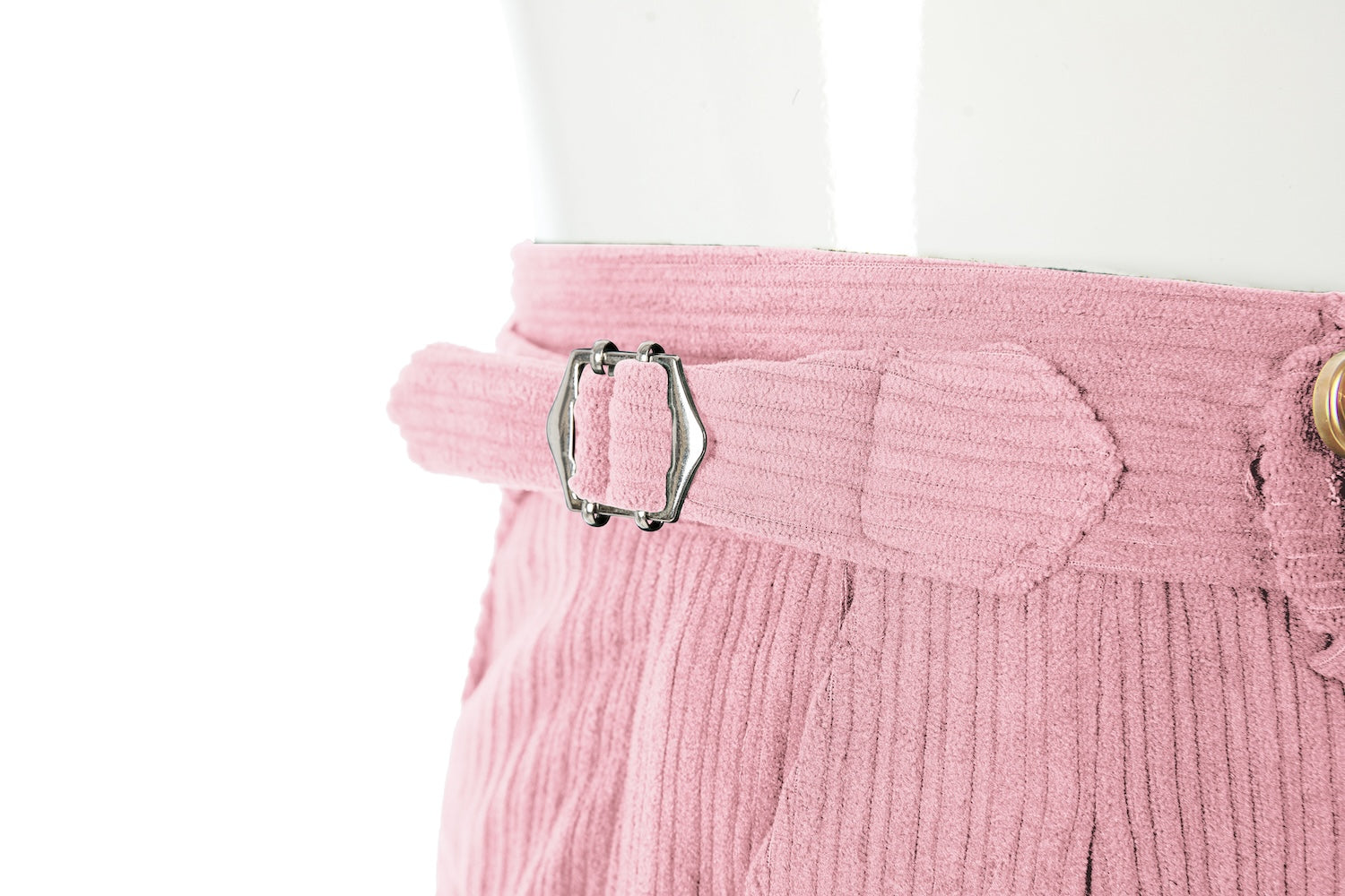 Waistband close-up of men's light pink corduroy pants – button closure and belt loops