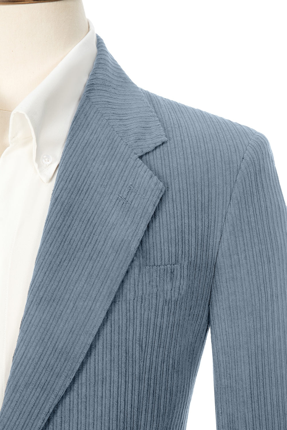 Close-up of blue corduroy prom blazer lapel – textured fabric, elegant cut
