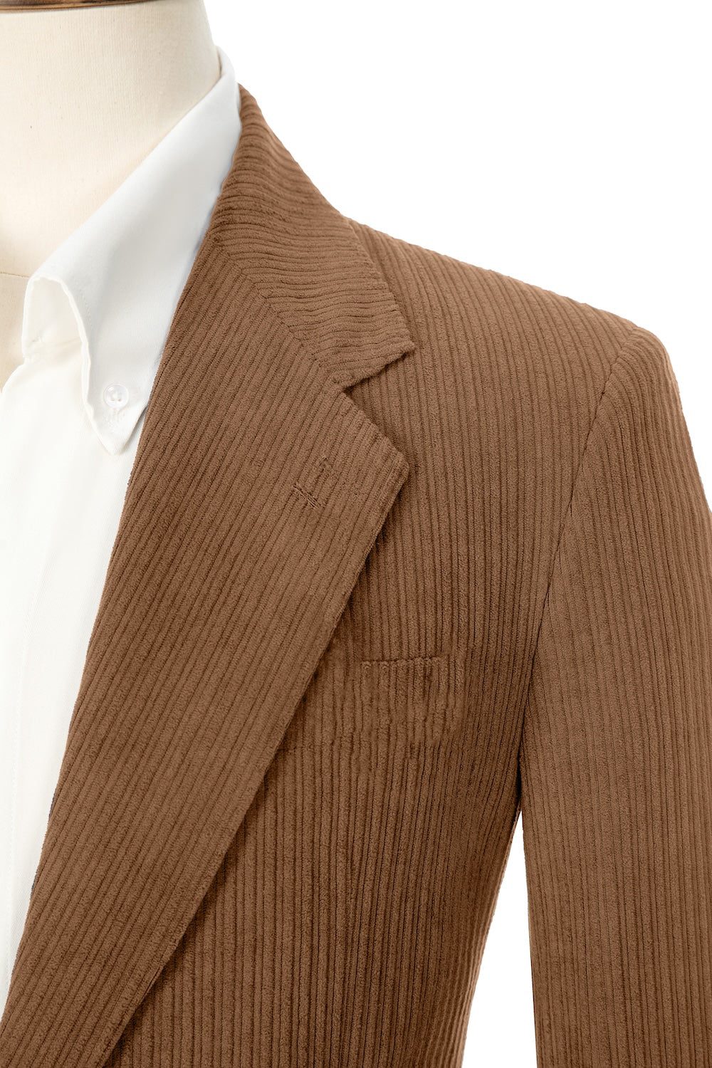 Close-up of caramel corduroy prom blazer lapel – textured fabric, elegant cut