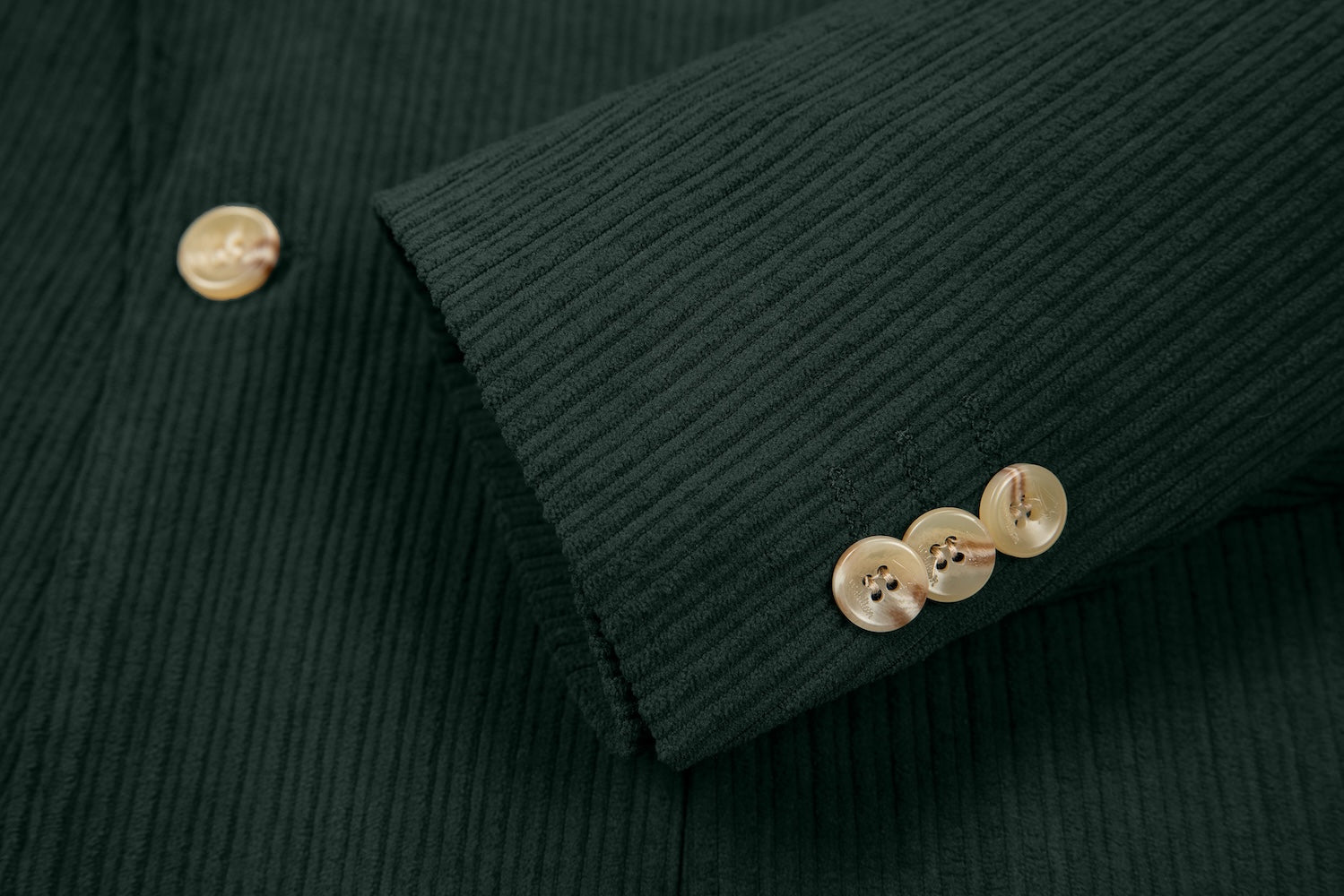 Cuff detail of dark green corduroy prom blazer – formal sleeve with neat finish