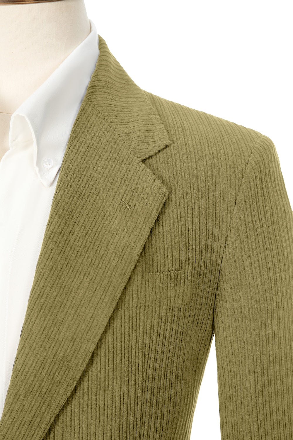 Close-up of green corduroy prom blazer lapel – textured fabric, elegant cut