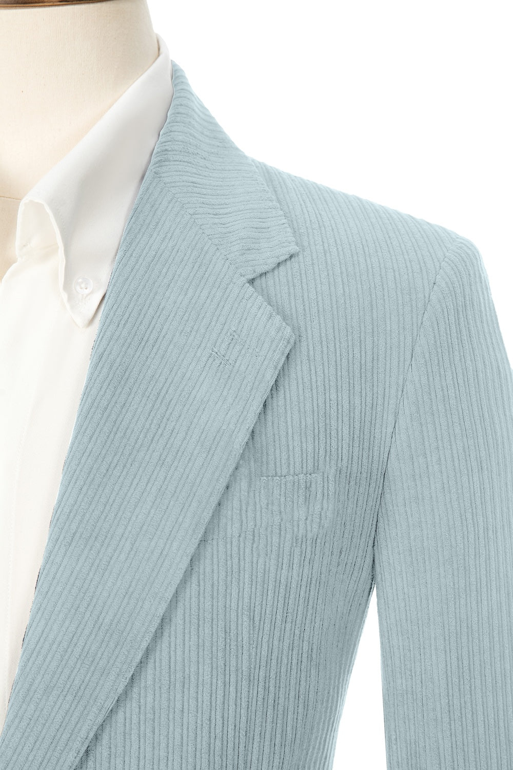 Close-up of light blue corduroy prom blazer lapel – textured fabric, elegant cut