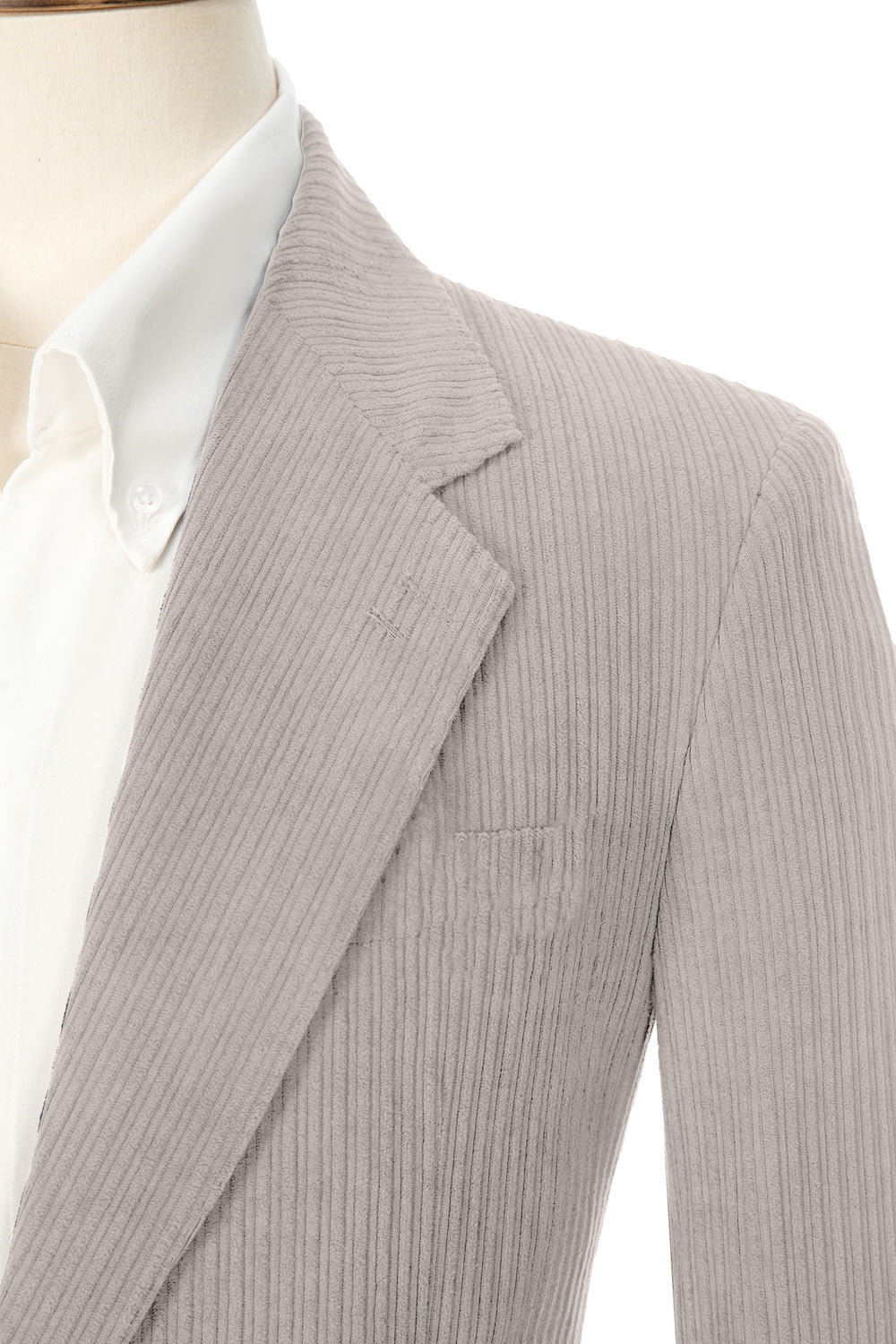 Close-up of light grey corduroy prom blazer lapel – textured fabric, elegant cut