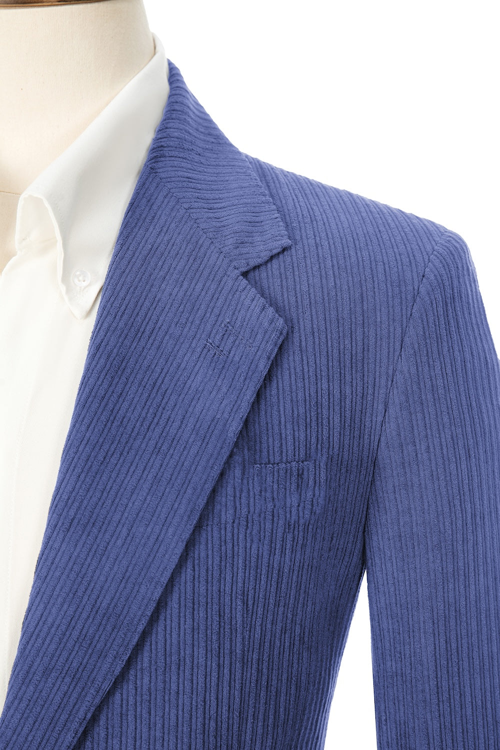 Close-up of light royal blue corduroy prom blazer lapel – textured fabric, elegant cut