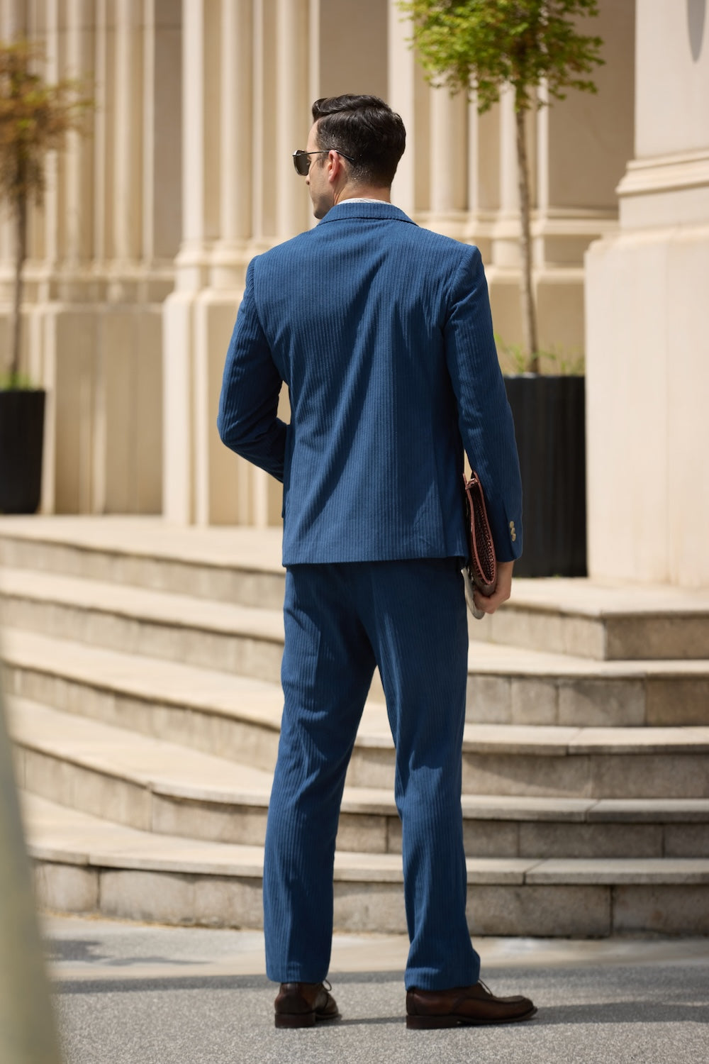 Back view of royal blue corduroy suit – tailored cut showing full back silhouette and blazer drape