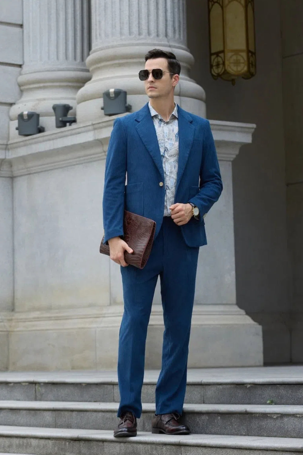 Full body view of royal blue corduroy prom suit – paired with patterned shirt and brown dress shoes